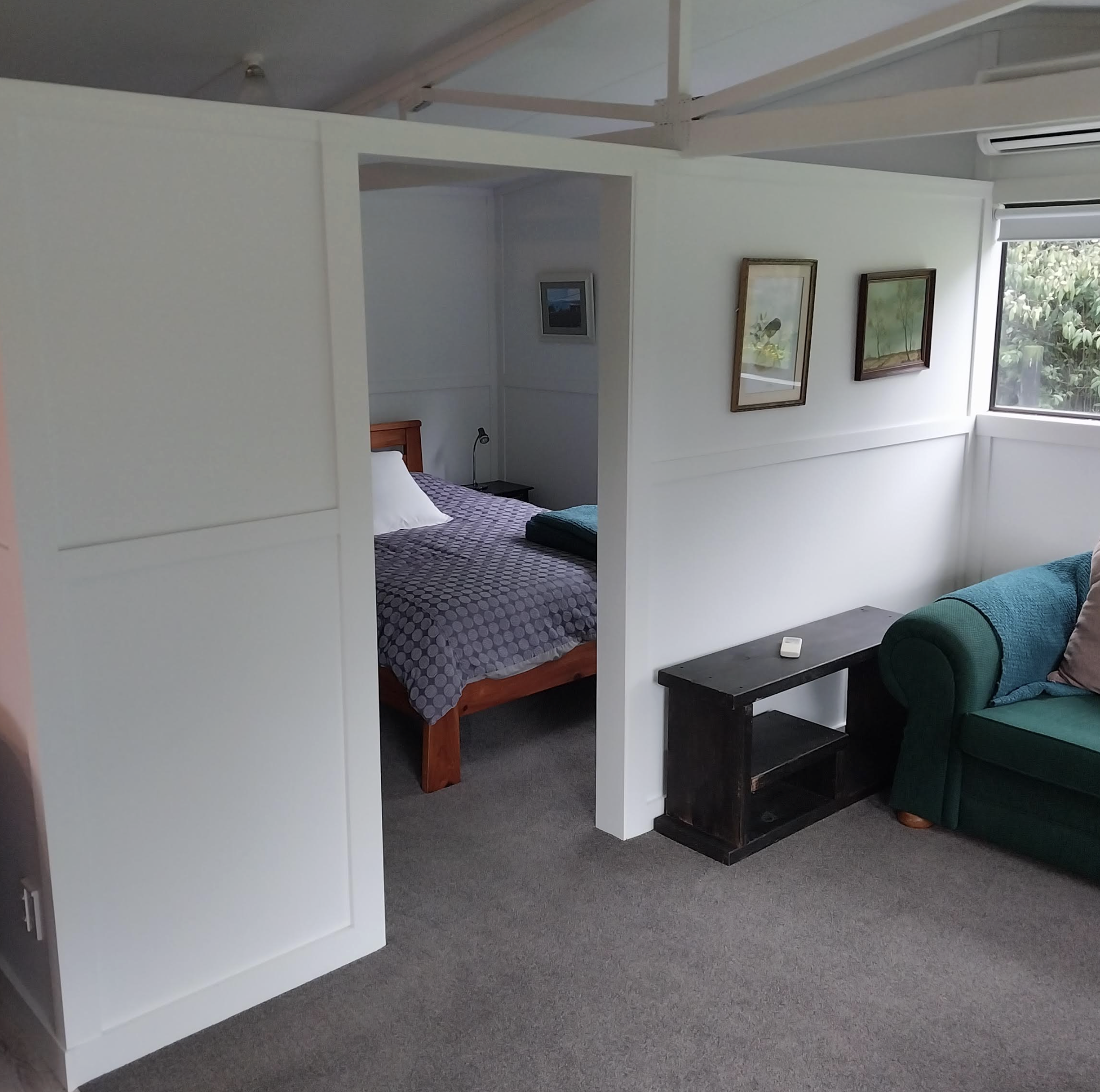 Separate bedroom with a double-size bed