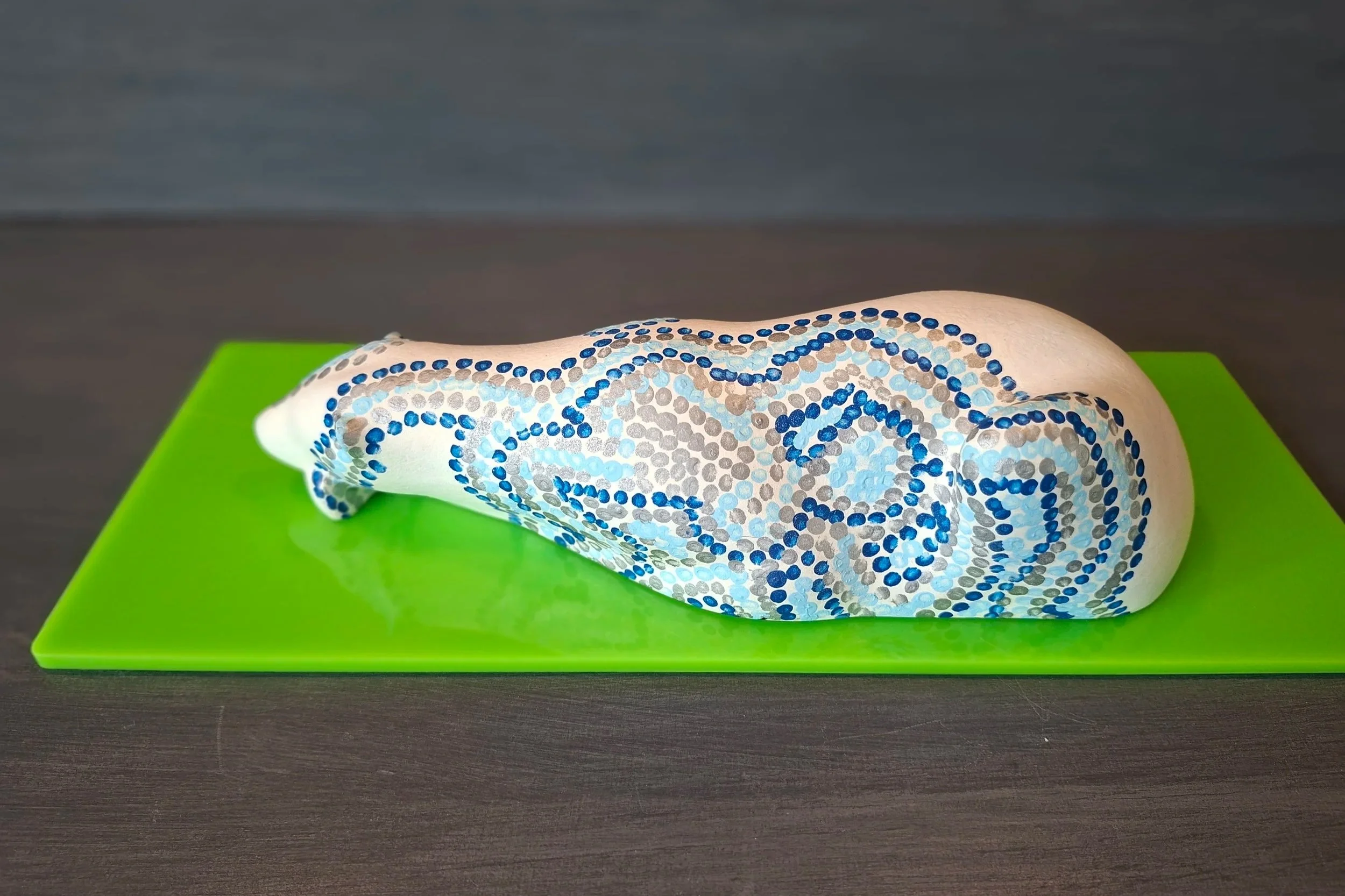Resting Cub with Blue Dots Influenced by Huichol (Mexican) Art.
Acrylic H7cm  W29cm  D14cm
£225.00