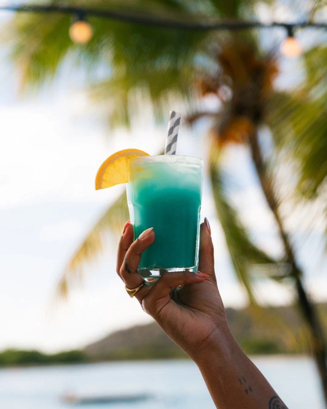 Zanzibar in a glass: Blue, Cura&ccedil;ao, dushi flavour and a sunset to top it off. Our drinks are made for late afternoons by the beach.