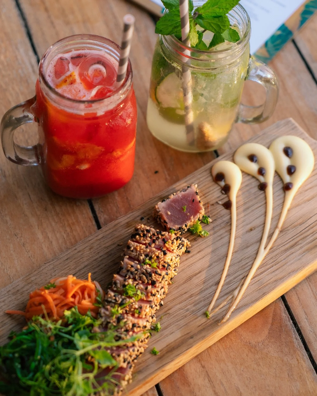 Our fresh tuna, colorful fruity drink, and chats while we watch the sun go down. 

#oceanview #sunandsand #janthiel #kokoscuracao #relaxedatthebeach