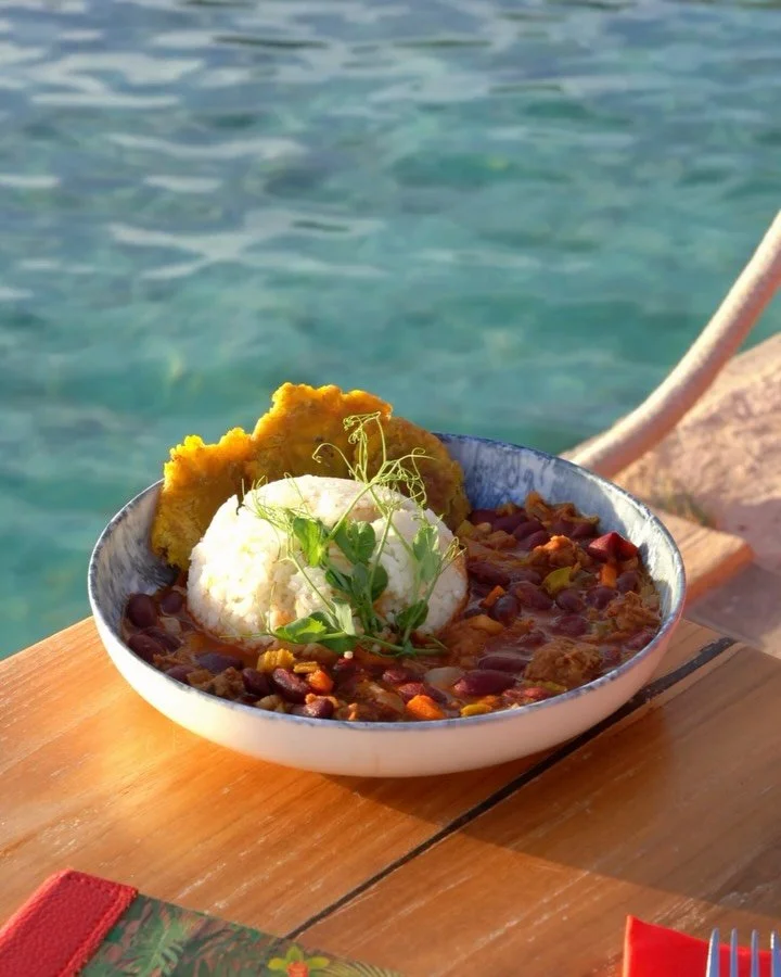 Bright water and our coconut chili sin carne, and a very convincing plate in the middle of it all