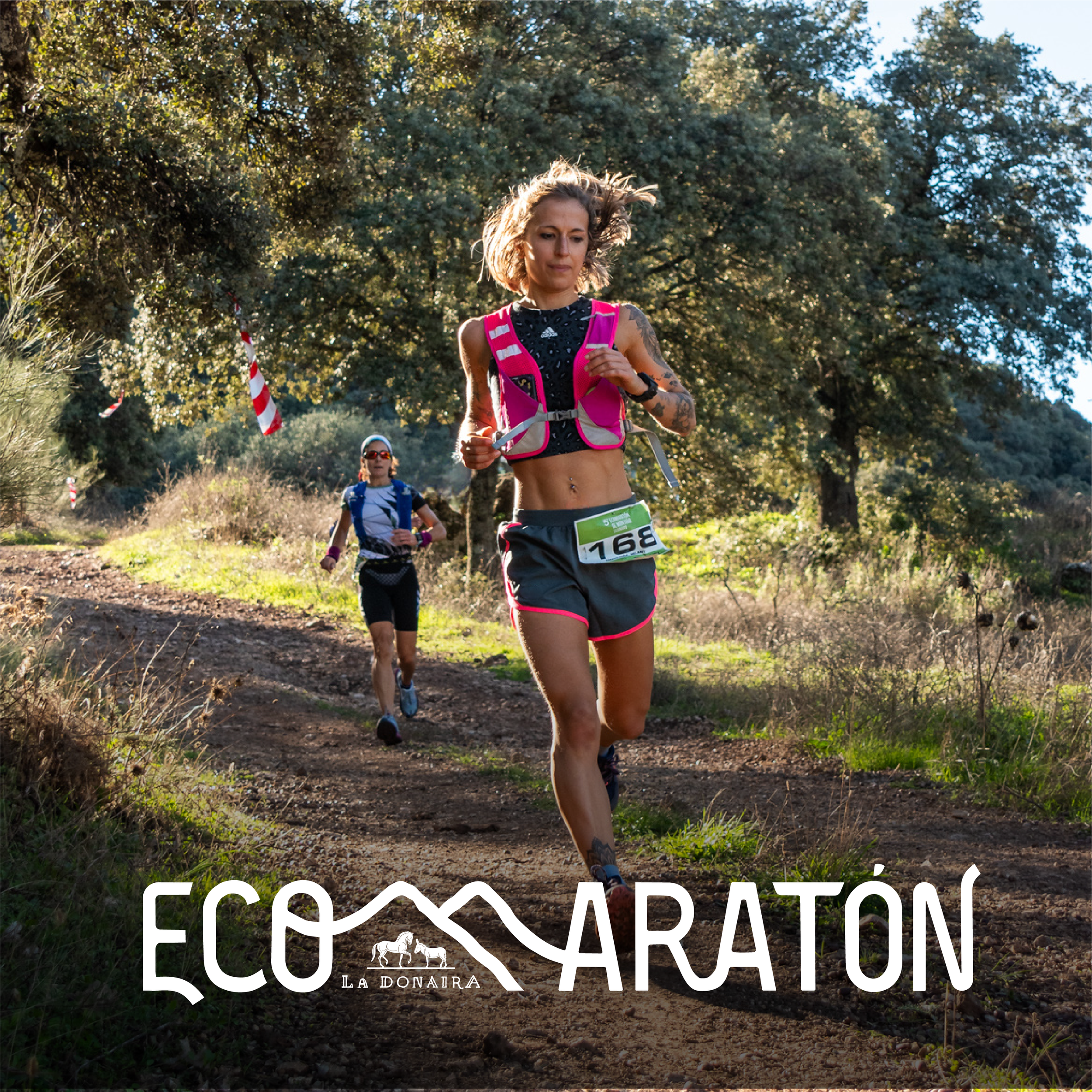 A scenic mountain landscape with a trail, two runners, and a large sign promoting the VileEco Mountain Marathon organized by La Donaira.