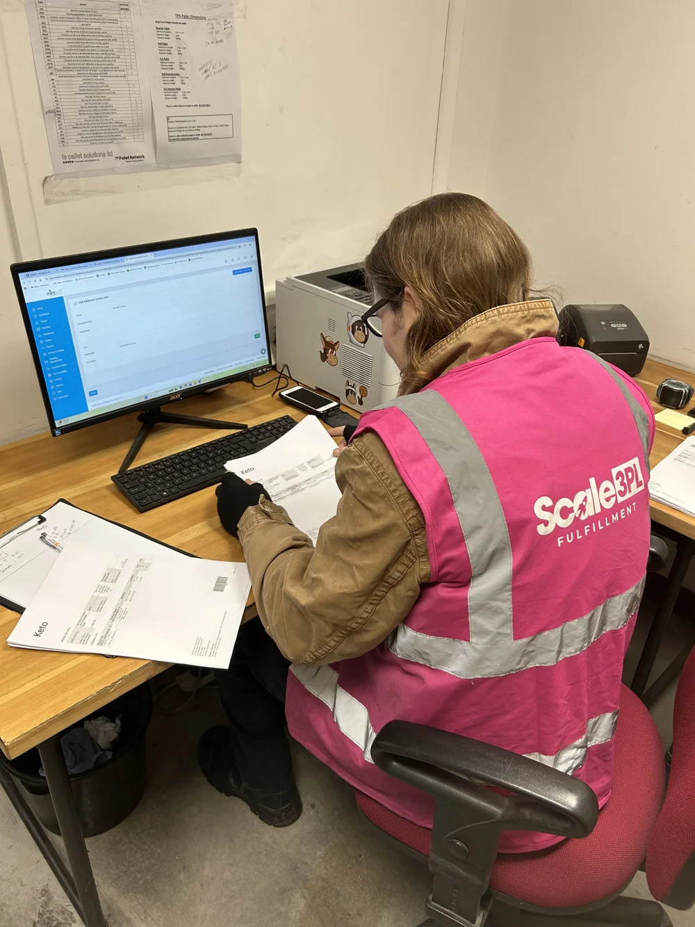 Scale 3PL team member at a packing workstation