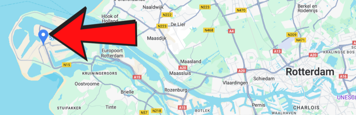 Map of Rotterdam area in the Netherlands with a large red arrow pointing to a location in the northwest part of the city, near the water