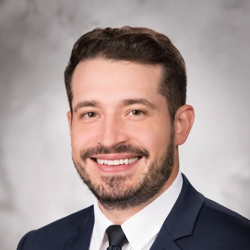 A professional headshot of Dr. Andrew Schwinn.