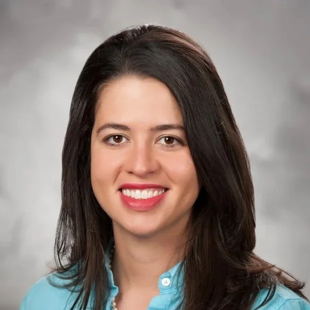 A professional headshot of Dr. Elena Gimenez.
