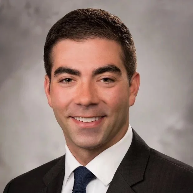 A professional headshot of Dr. Jeremy Konheim.