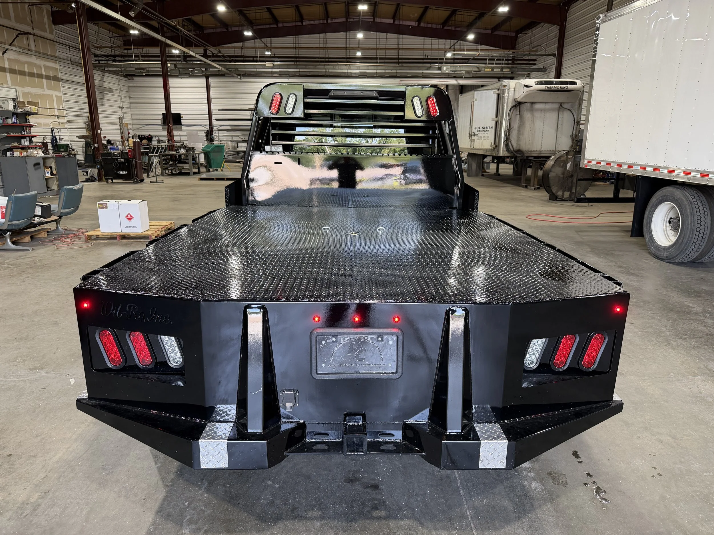Wil-Ro flatbed installed by Hamilton Companies Fleet ServicesInterlift by Palfinger logo