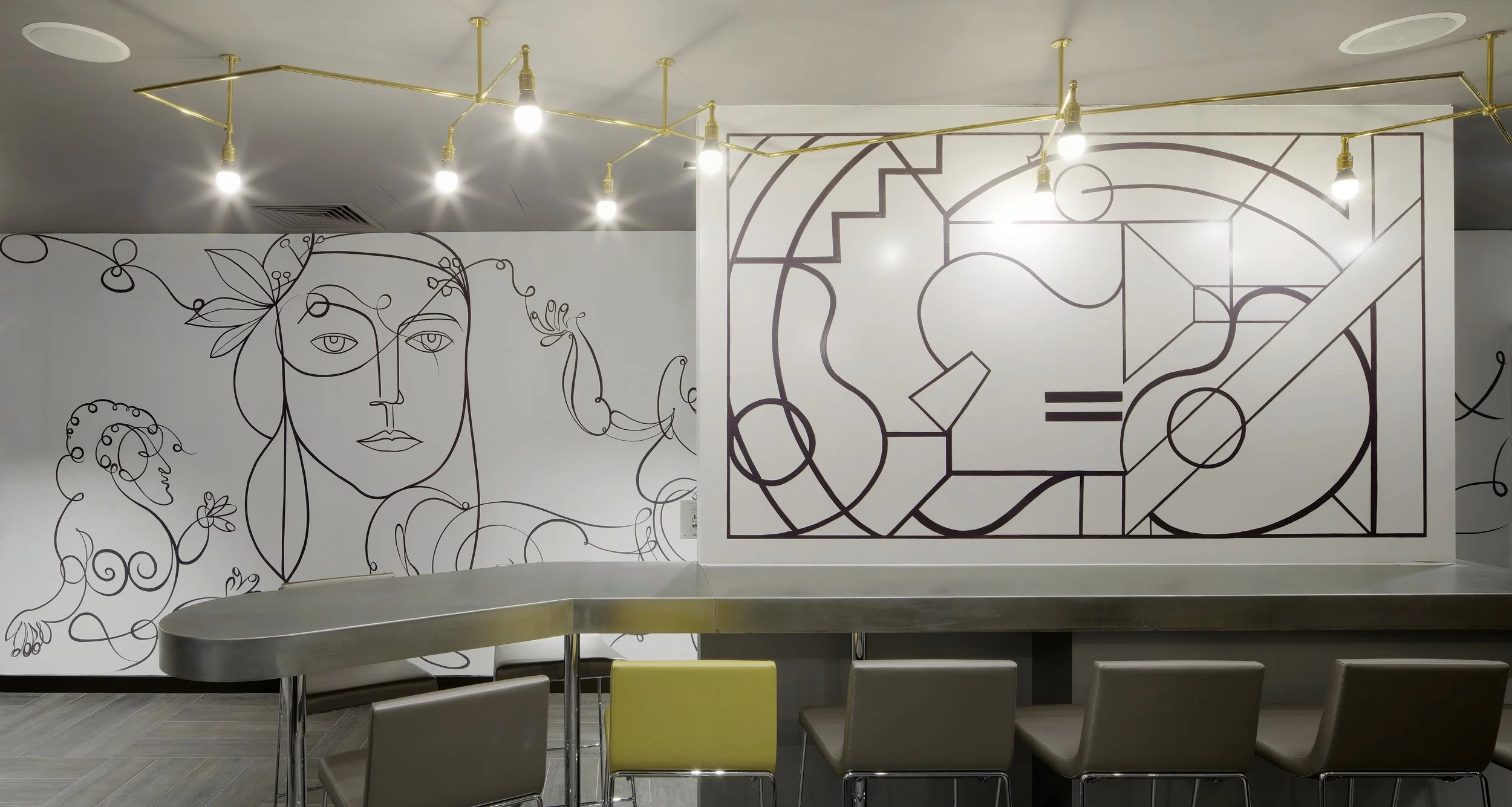 Detail view of whimsical line-painted wall murals in one area of the bar. 