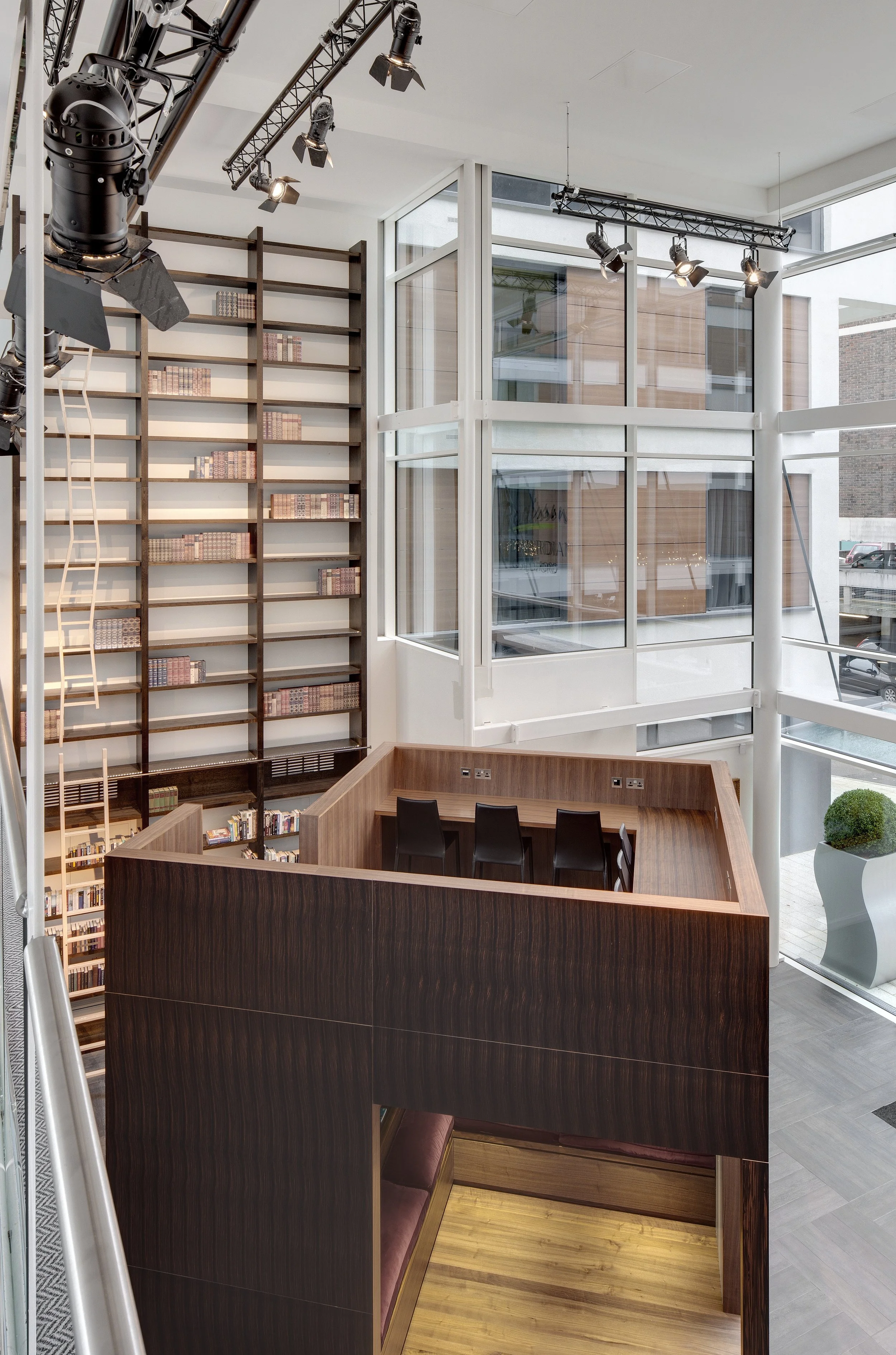 View of the top of the lobby cube from the nearby catwalk, with a view behind of a 7 metre bookshelf.
