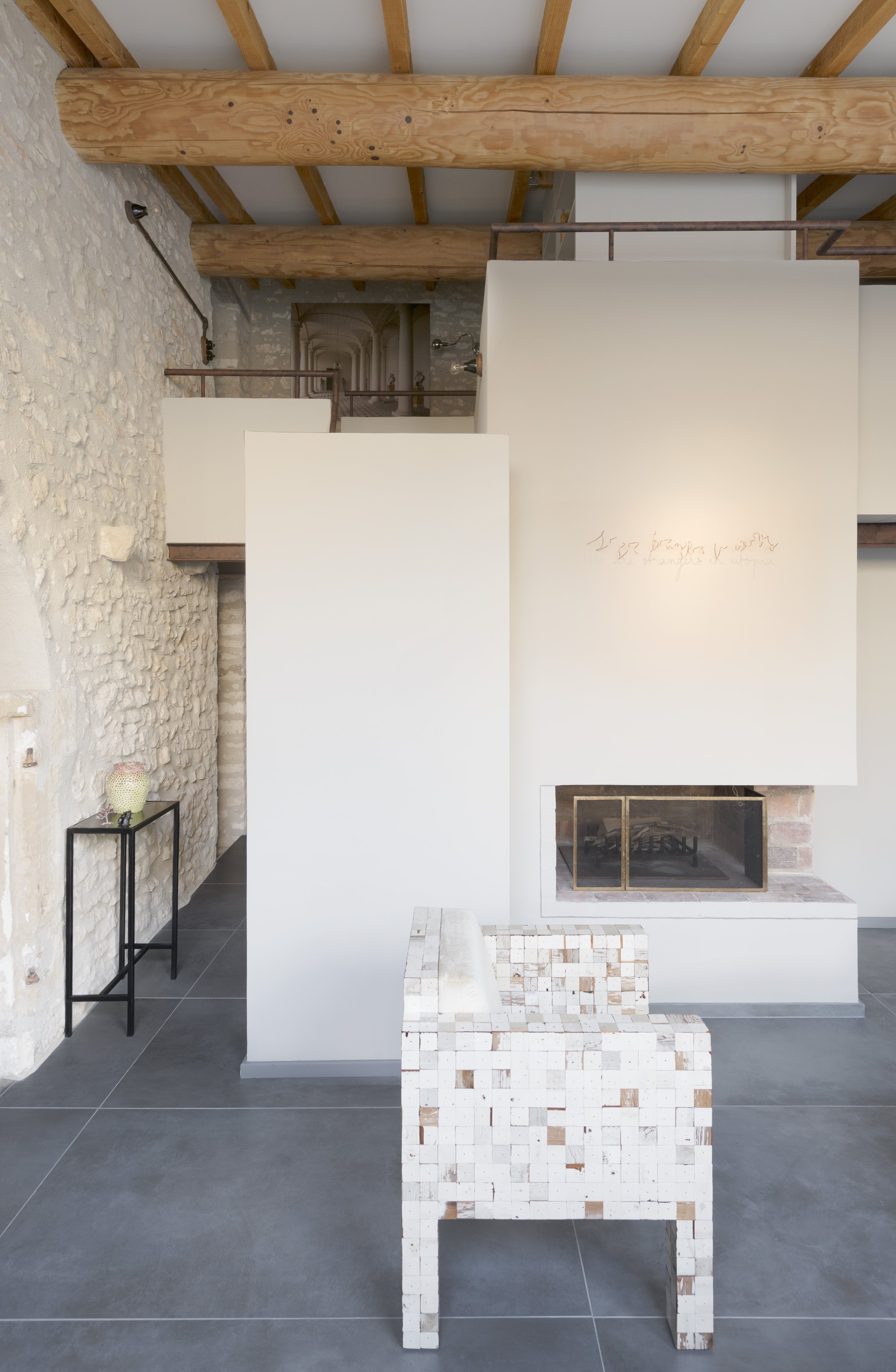 View of the cleverly arranged fireplace and staircase to make the best use of space.