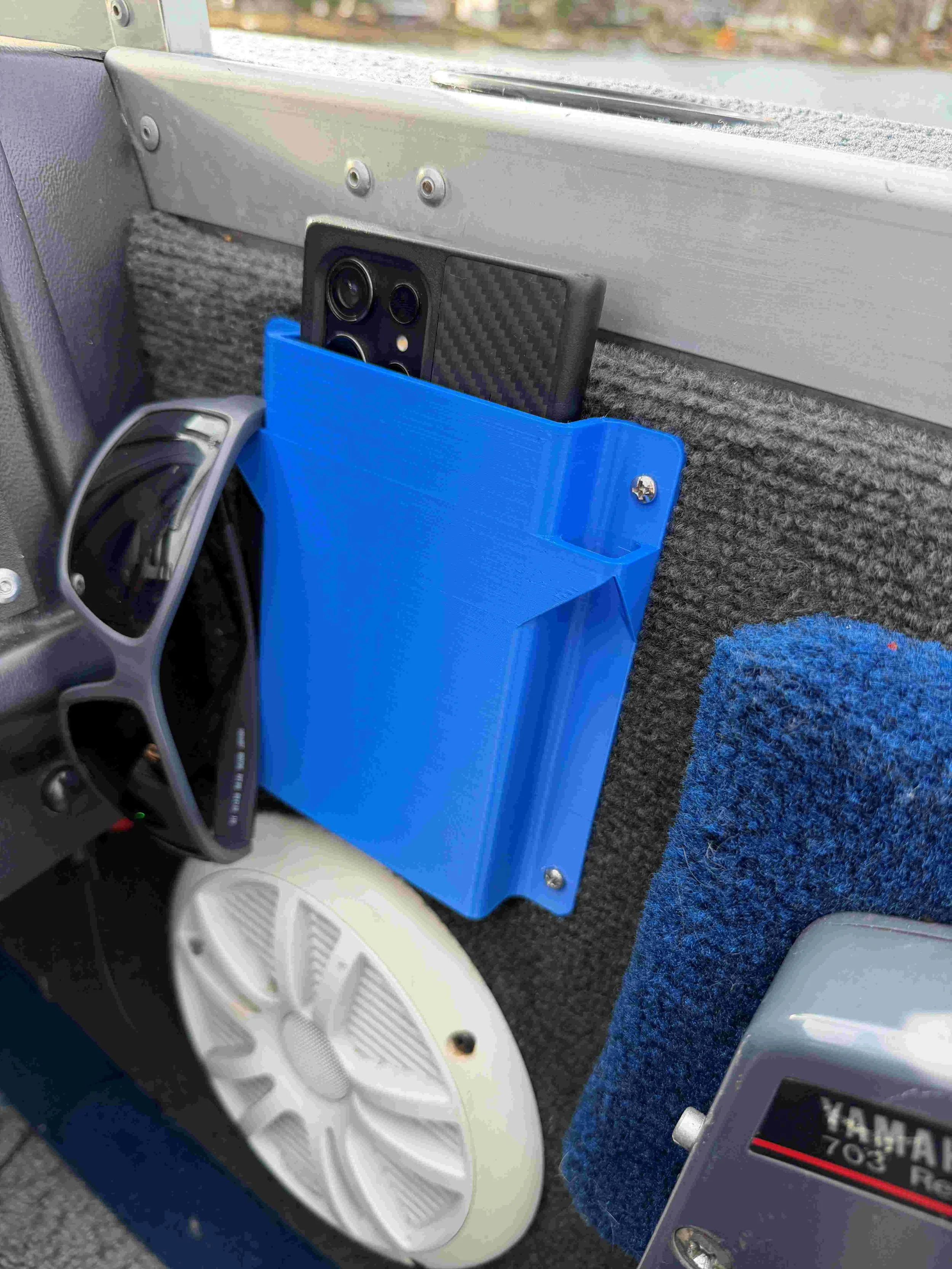 Phone-holder-in-boat-phone-inside-with-sunglasses-on-bracket.jpg