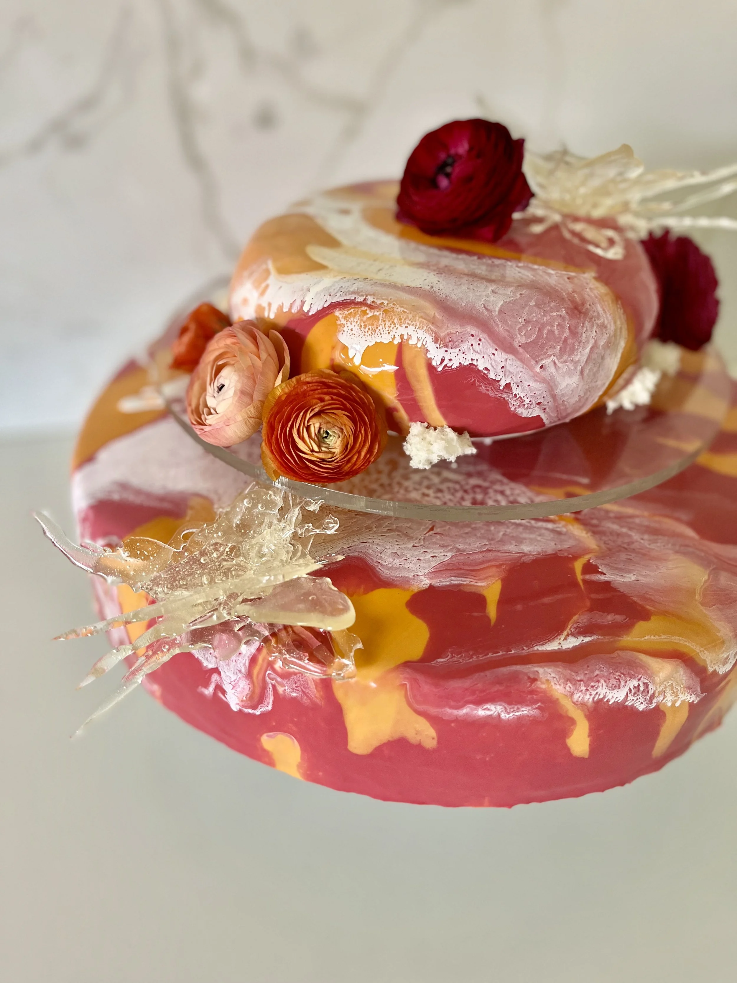 Nō 48 -------- M&J TWO TIER MOD CAKE - vanilla bean and orange blossom sponge, madarin-lemon chutney and orange blossom Chantilly cream center.  Adorned with sugar butterflies and Ranunculus blossoms.  Tiers separated with clear lucite disk.
$250 + 