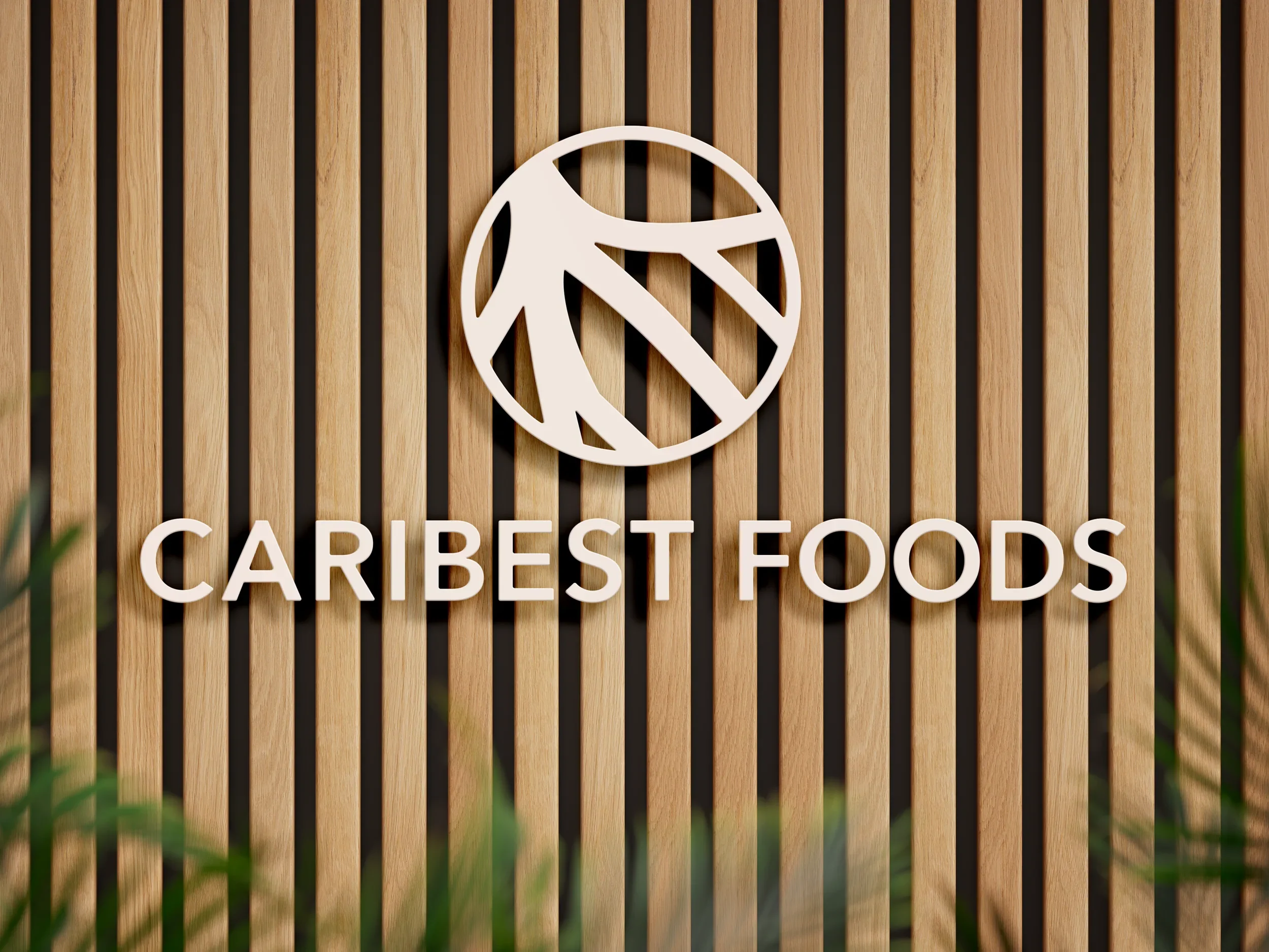 Símbolo y nombre de Caribest Foods en la pared de una oficina