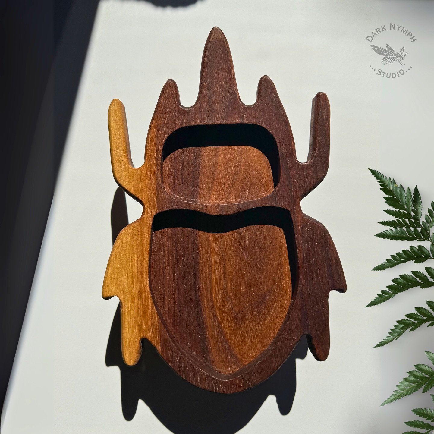 🪲This beetle doesn&rsquo;t scuttle-it sorts 🪲

Made from rich walnut with gorgeous sapwood streaks, each tray is one-of-a-kind and shaped like a chubby little armor bug. Great for your keys, earbuds, wallet, evil eye charms, bones of your enemies o