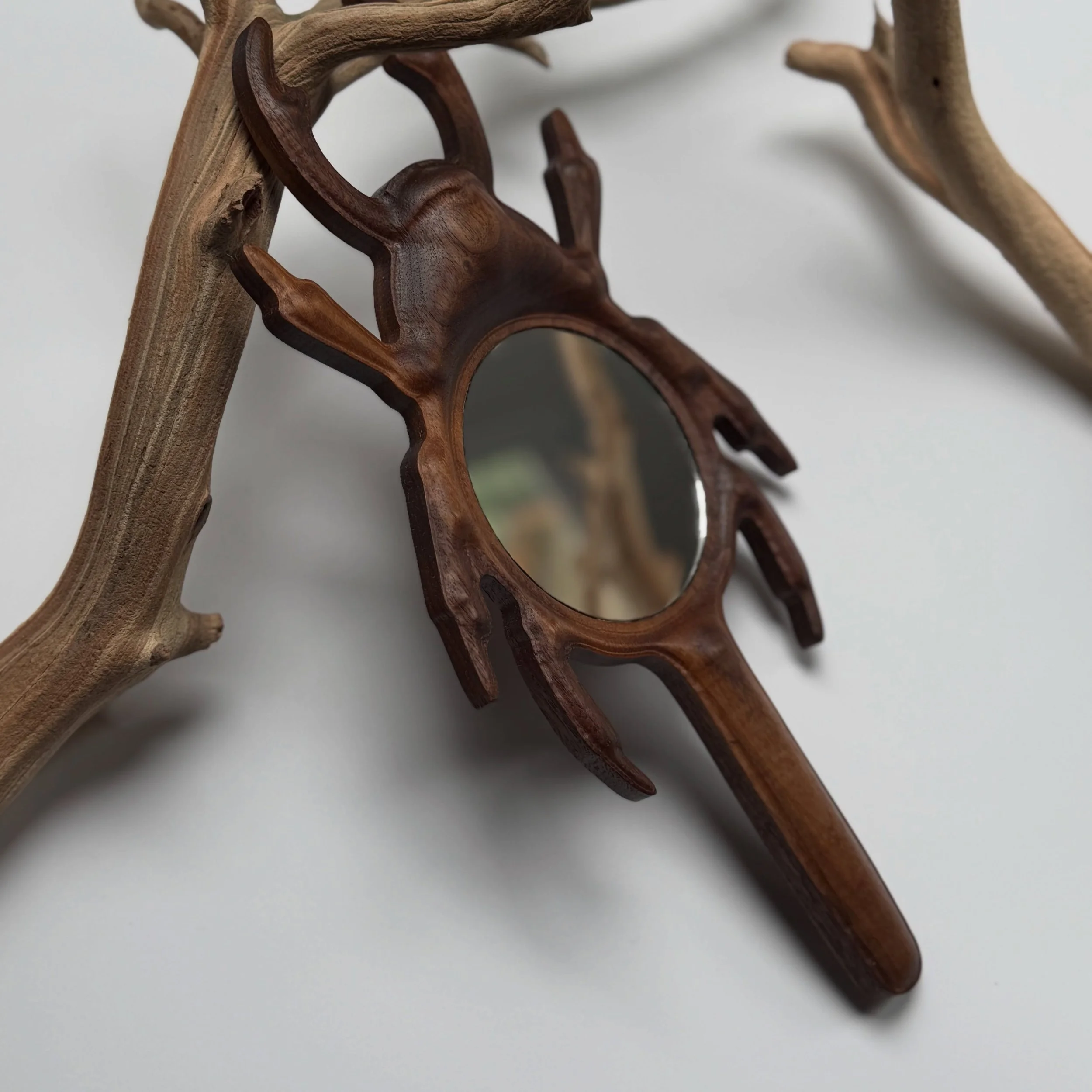 For the people who want their home to feel a little uncanny 🌙

These walnut beetle mirrors were inspired by old curiosity cabinets, forest walks, and those strange ornate objects you find once and think about forever afterward.

I didn&rsquo;t want 