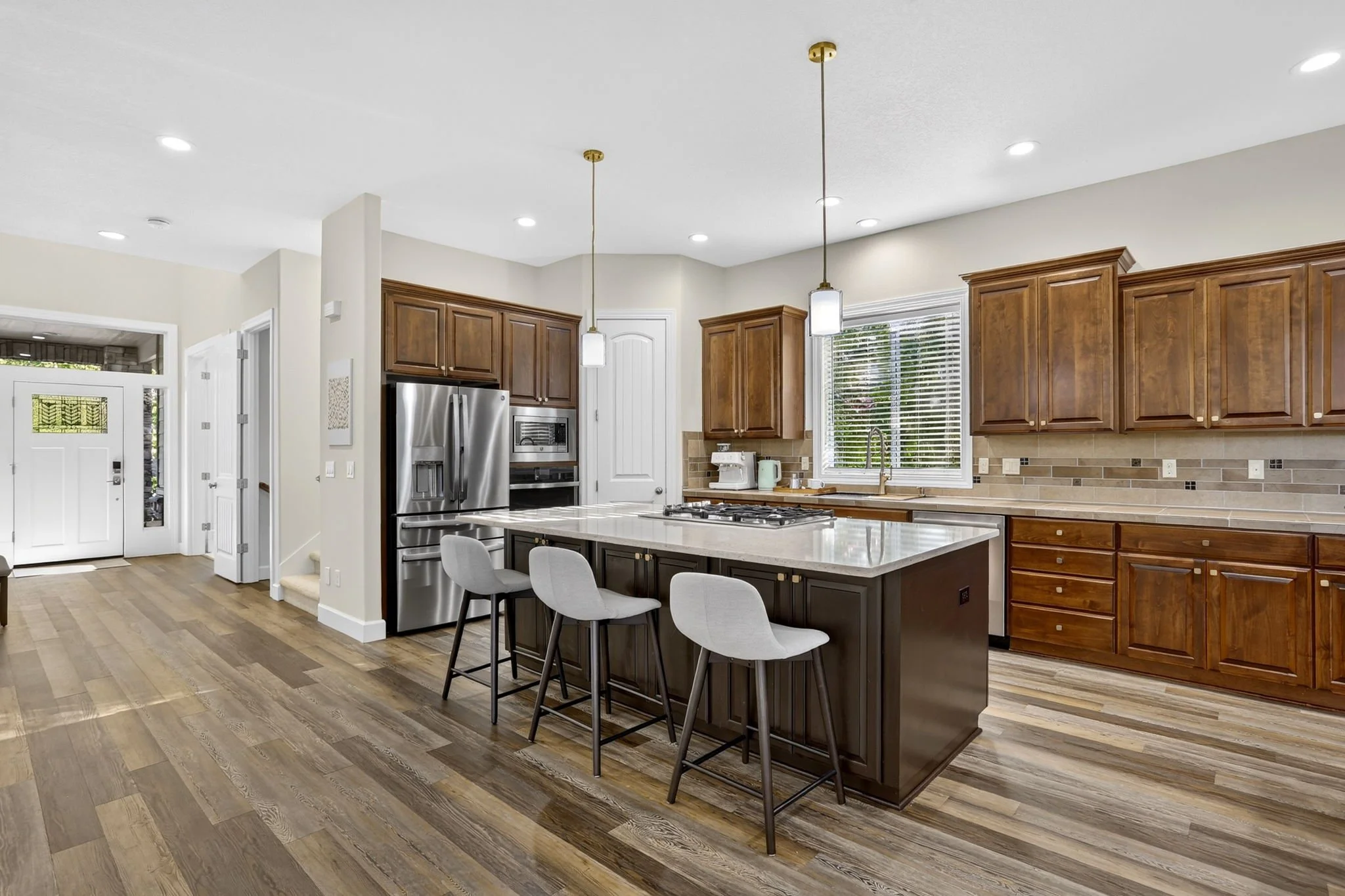 11368 NW Pumpkin Ct - Convenient Layout for Meals + Gatherings