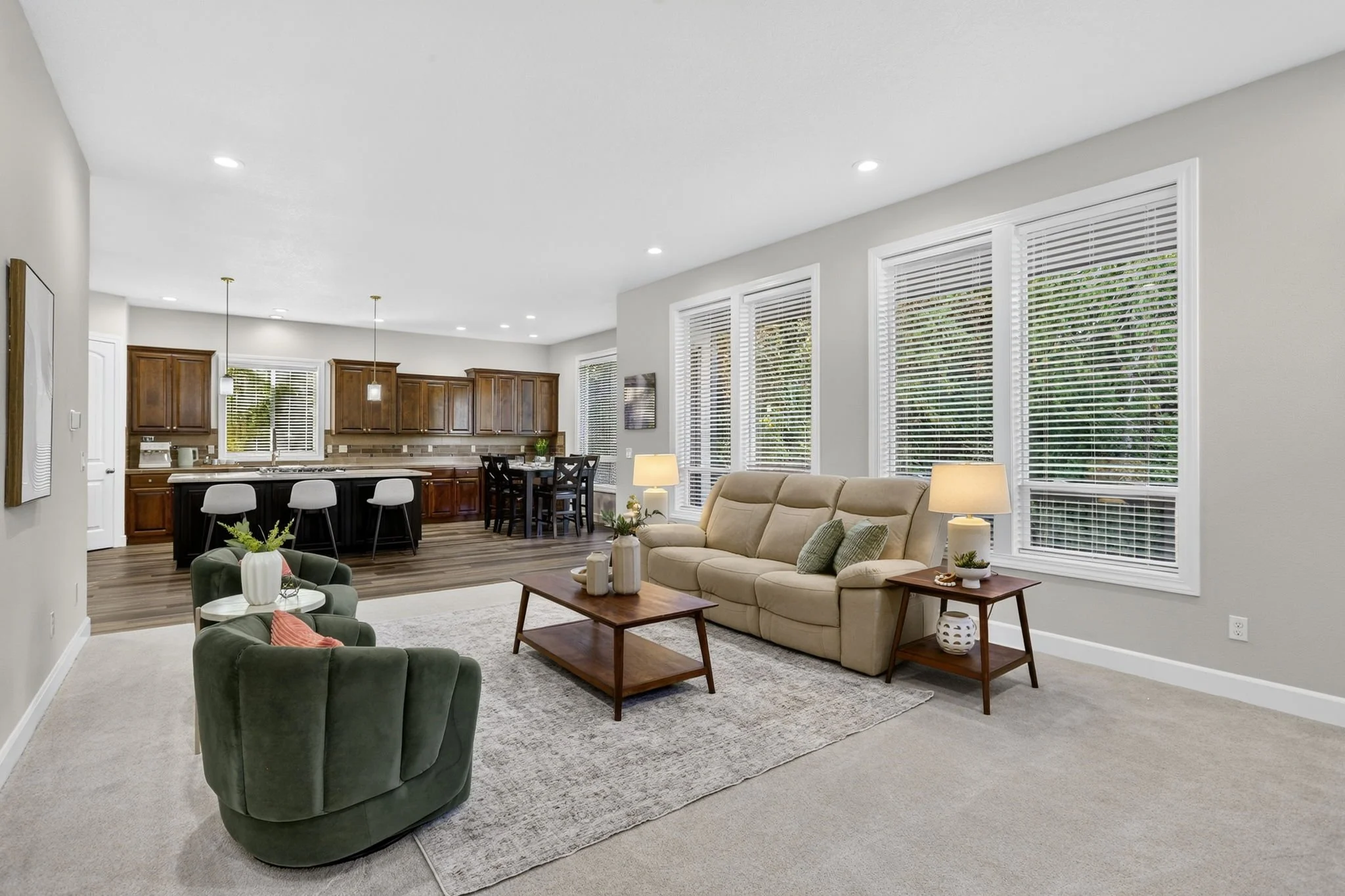 11368 NW Pumpkin Ct - Spacious Living Room with Wall of Windows