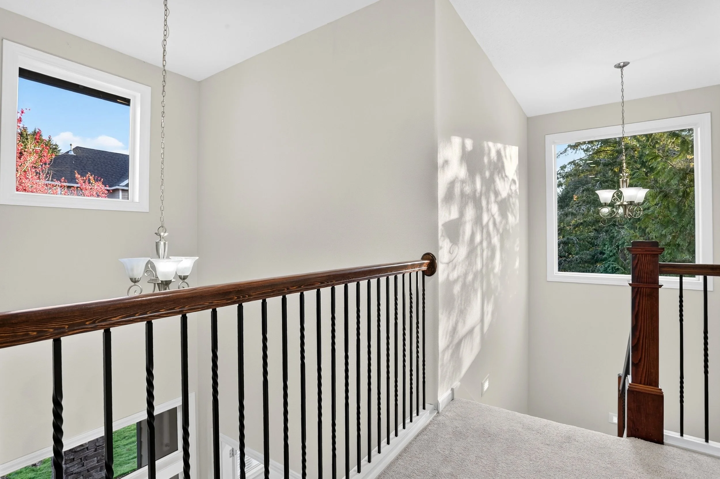11368 NW Pumpkin Ct - Upstairs Railings + Picture Window