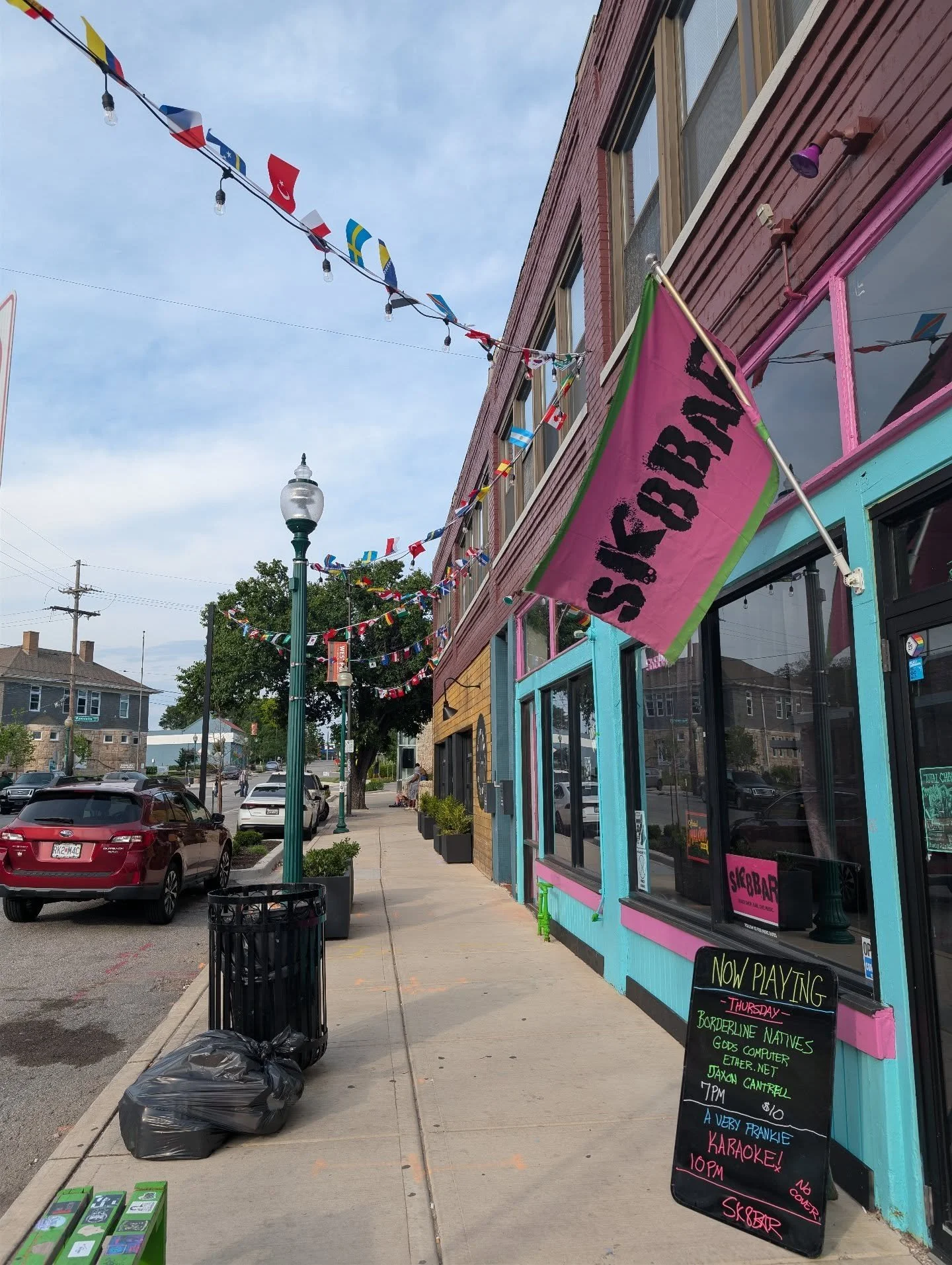 Apparently there has been a cup which has traveled around the world and it's coming to KC so they put these lights and flags outside to celebrate it!! We should fill it with Mal&ouml;rt!