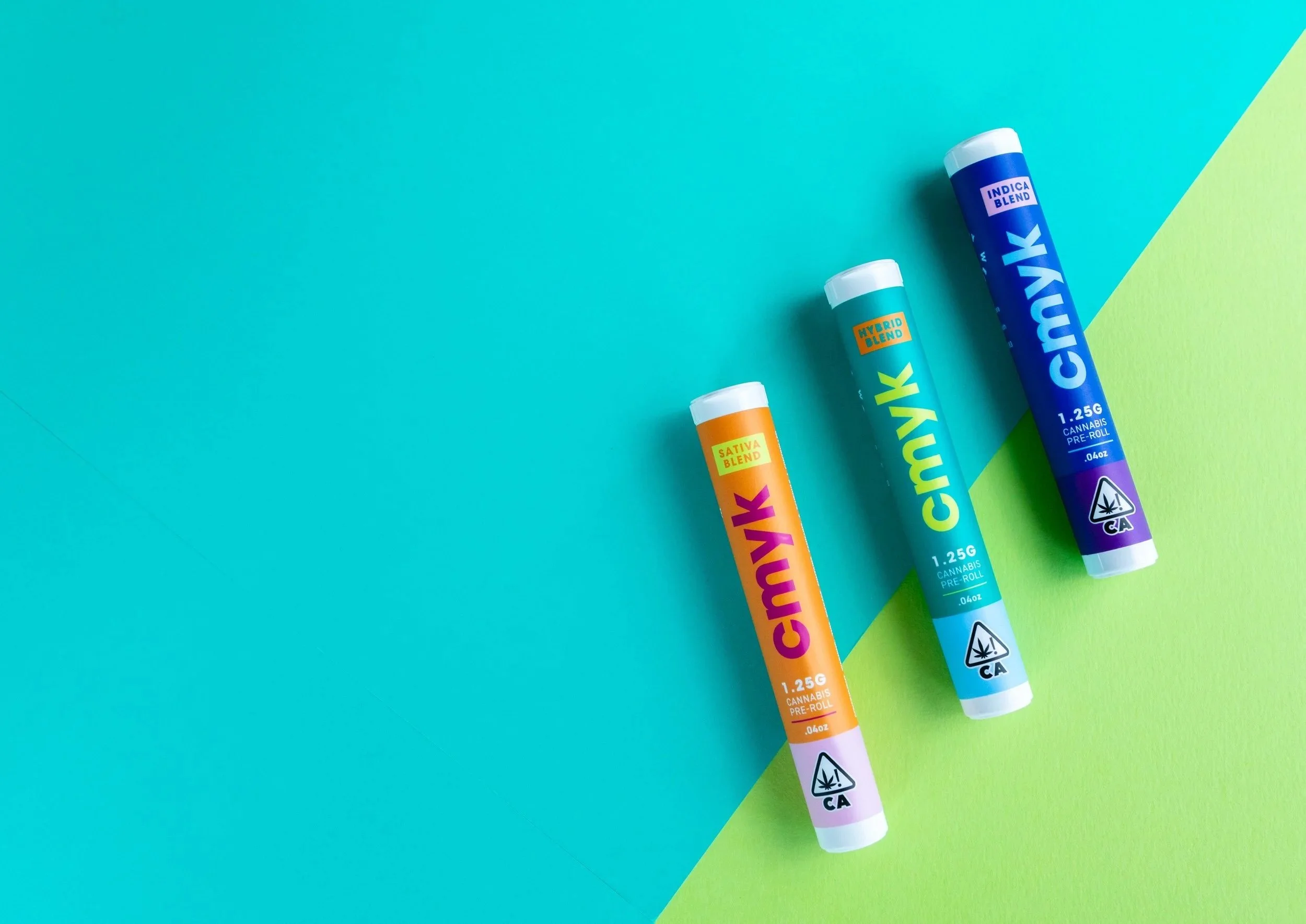 Three cannabis pre-roll tubes on blue and green background, labeled 'CANNY' with different blends: Sativa, Hybrid, and Indica.