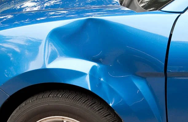 blue car dented by a collision