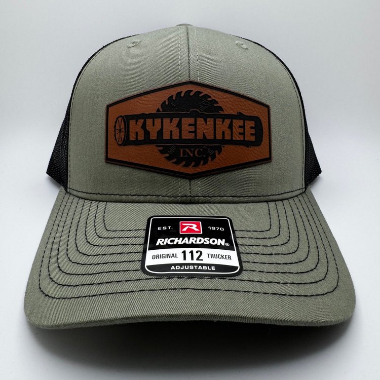 Richardson 112 loden green and black trucker cap with Kykenkee rawhide logo patch