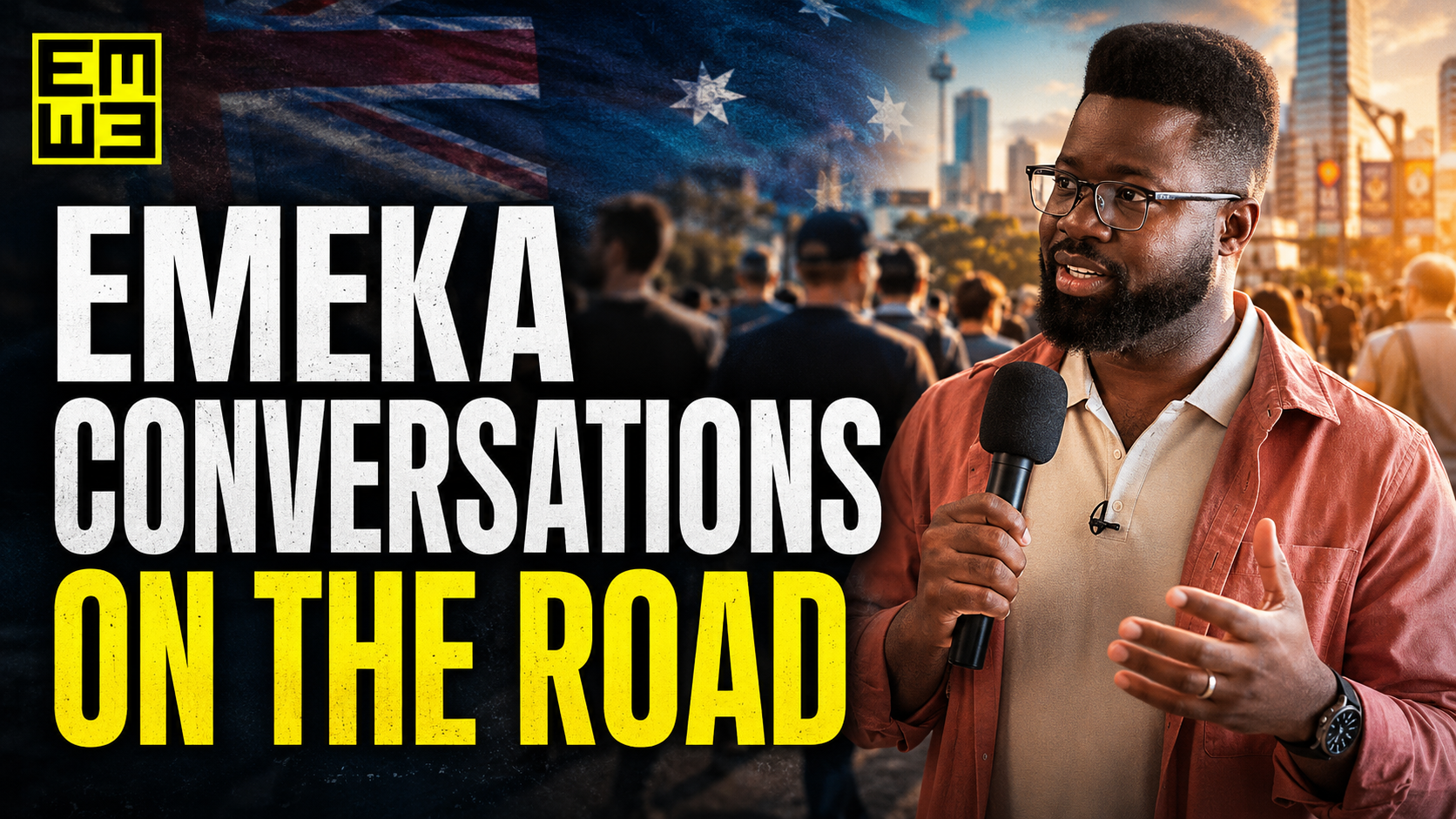 A man with glasses and a beard speaking into a microphone, standing outdoors in front of a crowd and a city skyline during sunset, with a digital overlay of the Australian flag and the text "Emeka Conversations On The Road."