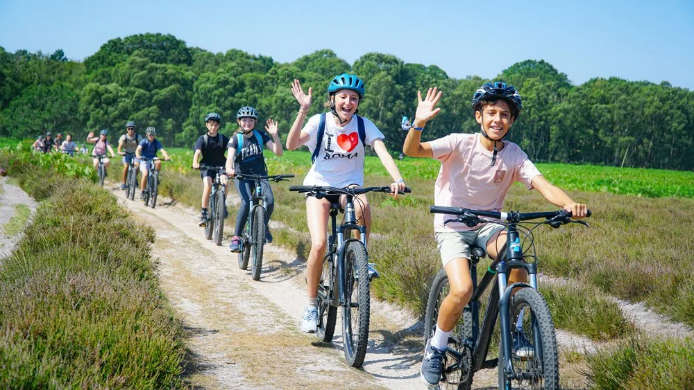 Kids and teens mountain biking in the Forest on a Residential Summer Adventure Camp in the UK