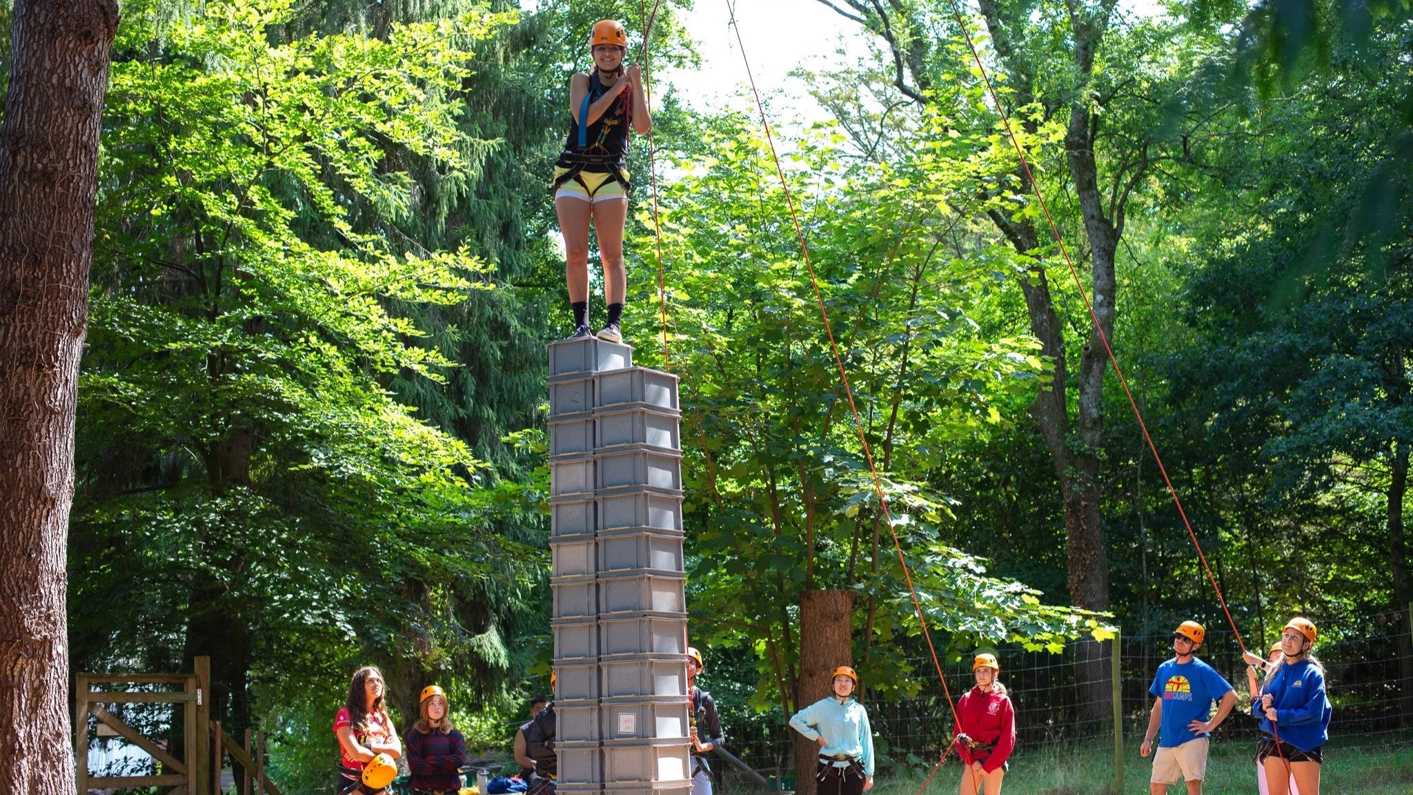 kids safely taking part in the crate stacking challenge, with labelled, maintained and checked equipment suitable for outdoor adventure.