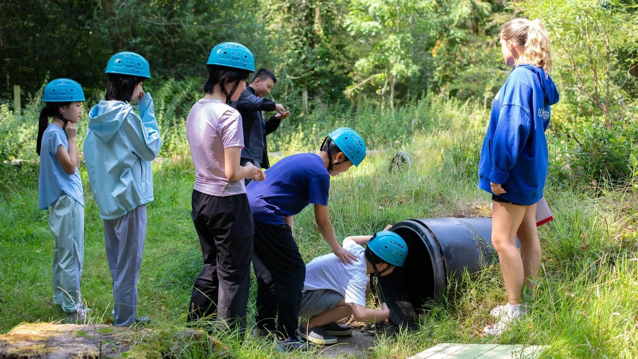 A group of international kids, being supervised on a 1:6 ratio by a camp counsellor