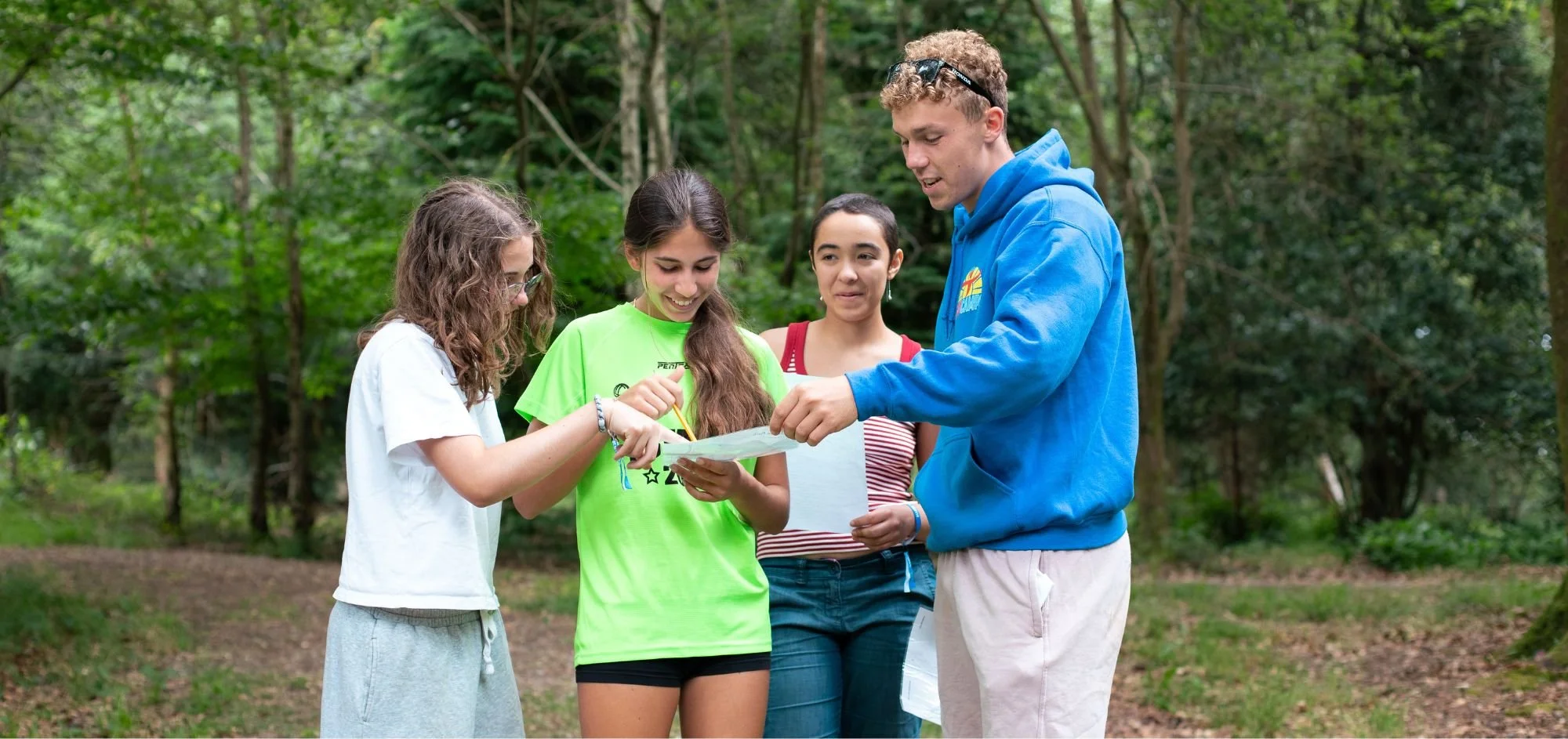 Group Leader Communicating With Campers To Represent Meaningful Connections You Can Get Outside Of ICEF