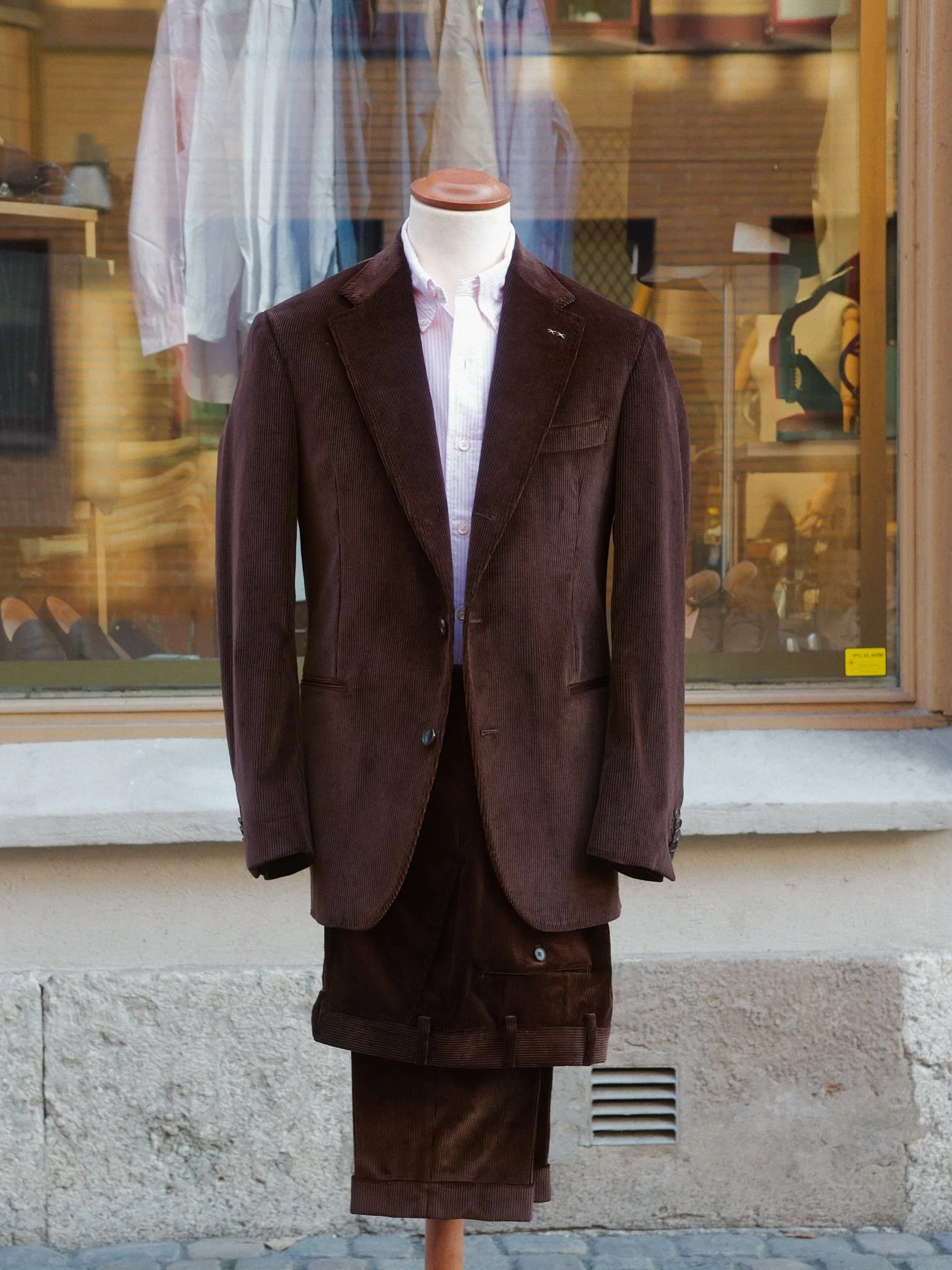 A brown cord suit is a stylish and versatile option for various occasions. The corduroy fabric adds texture and depth to the suit, making it both sophisticated and casual. Brown is a classic color that pairs well with a range of shirt and tie combina