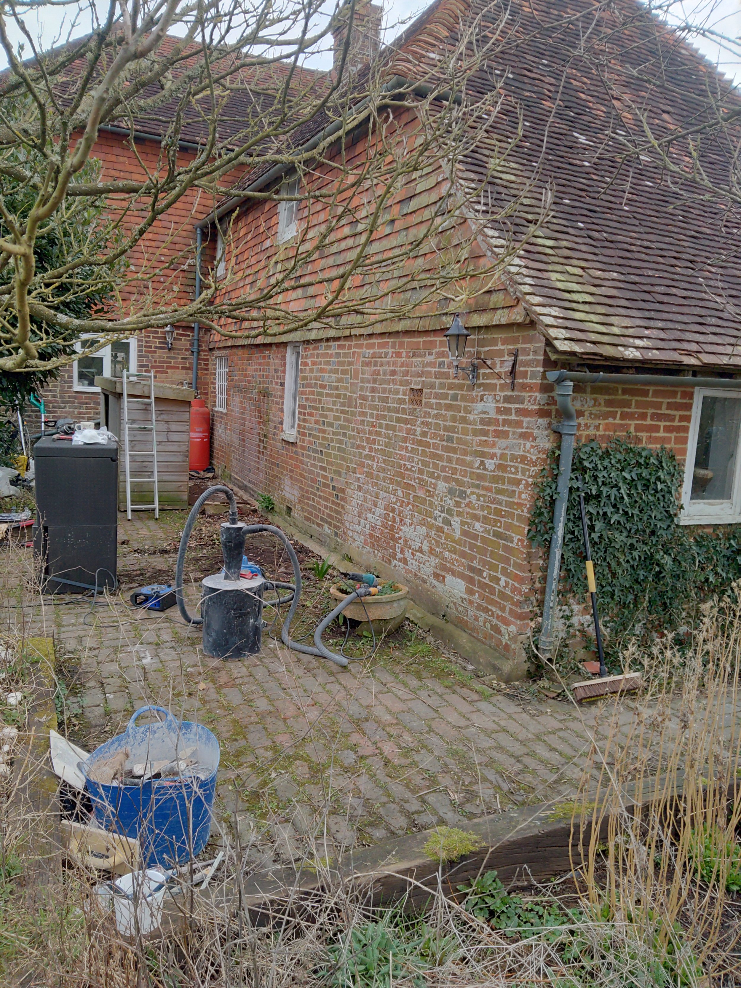 A Grade II listed cottage experiencing damp and algea. We removed the problem cement and replicated the rather hard Lime mix this victorian extension (on a much older building) was built with. This is part of a bigger project that involves the remov