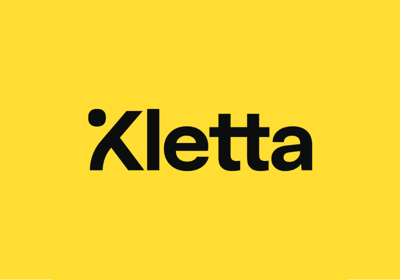 Keltainen tausta ja musta teksti 'Kletta'.