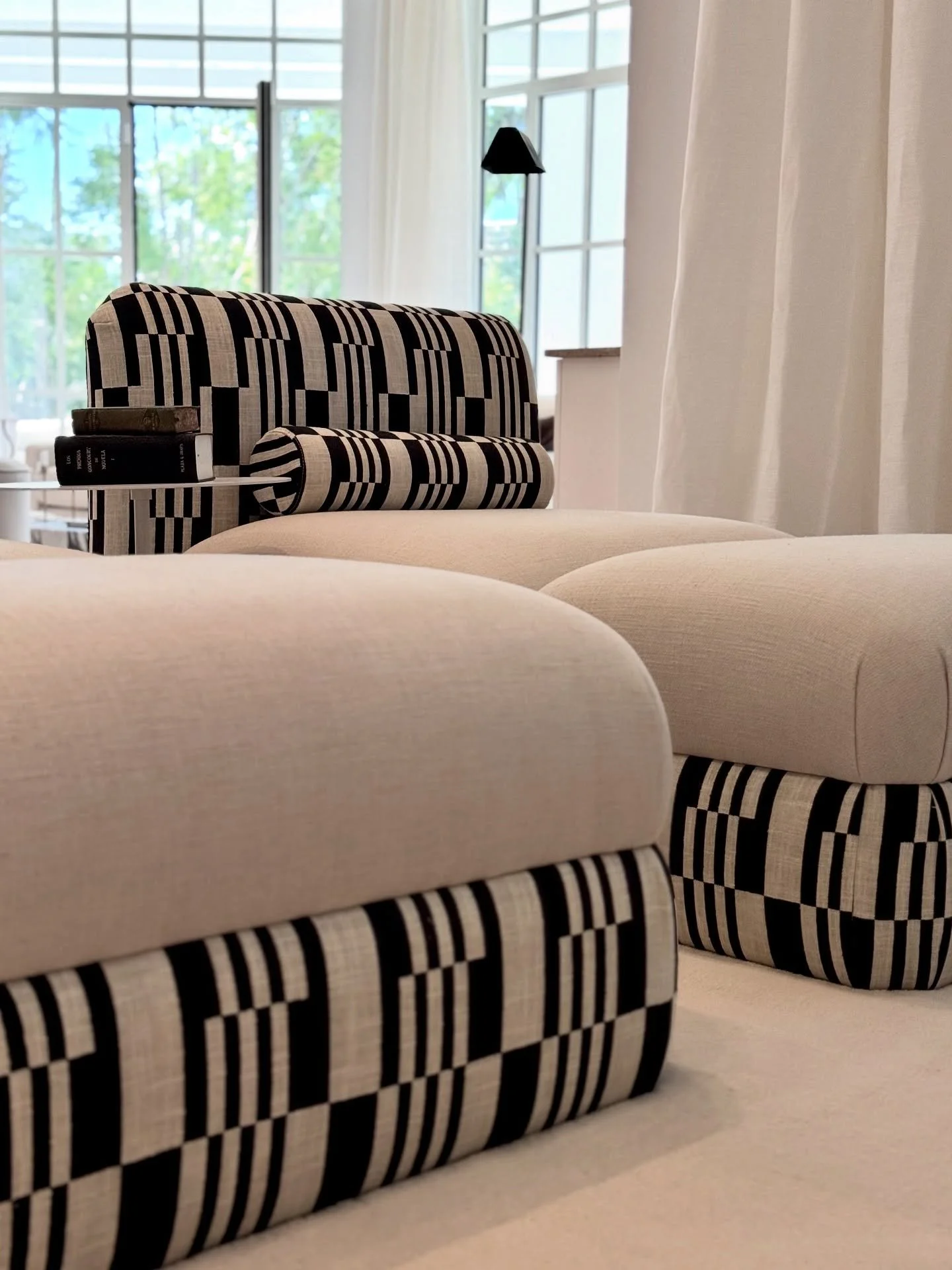 Our bespoke chaise lounge, crafted in two parts &ndash; an armchair and a pouf for ultimate versatility. 🤍