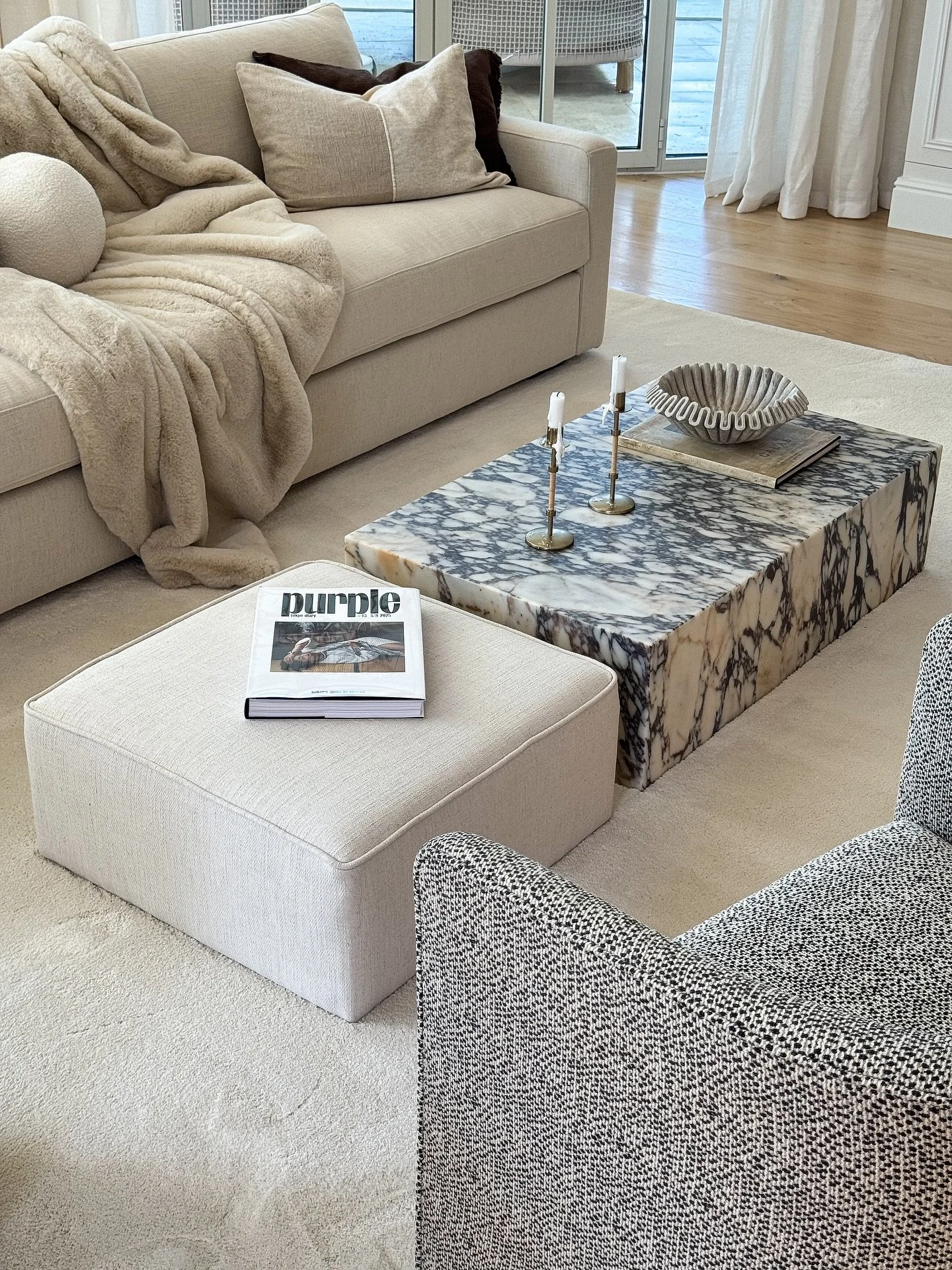 A soft extension of the marble table &ndash; 
a custom-made ottoman designed to create harmony and better proportions in larger spaces, where the Plinth table from Audo Copenhagen can sometimes feel a bit short.