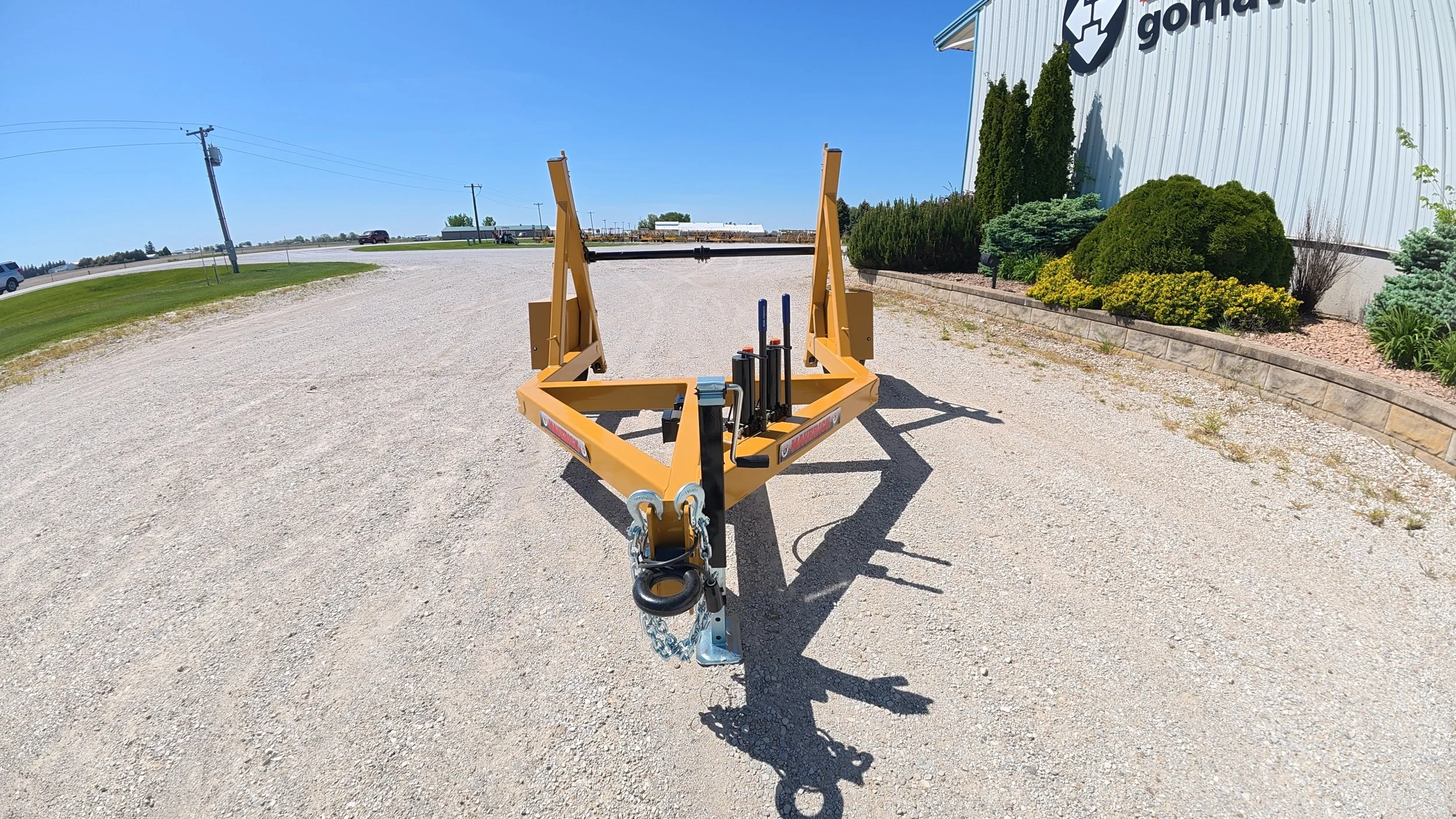 Single Reel Self Loading 7,000 lb. Axle Rated Trailer. From small fiber spools to large-diameter HDPE, PVC conduit, innerduct, and heavy electrical cable. Front view.