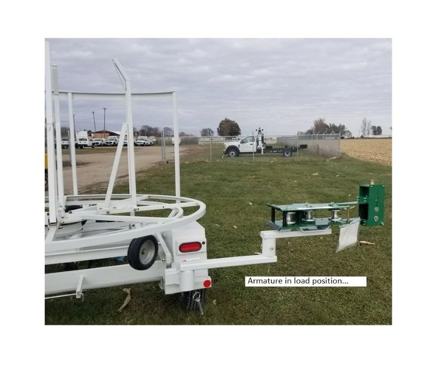 Trailer Mounted McElroy 2" Coil Pipe Line Tamer Armature in Load Position