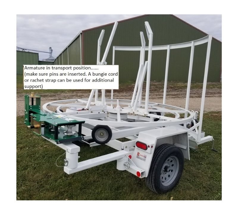Trailer Mounted McElroy 2" Coil Pipe Line Tamer Armature in Transport Position. Right Side View.