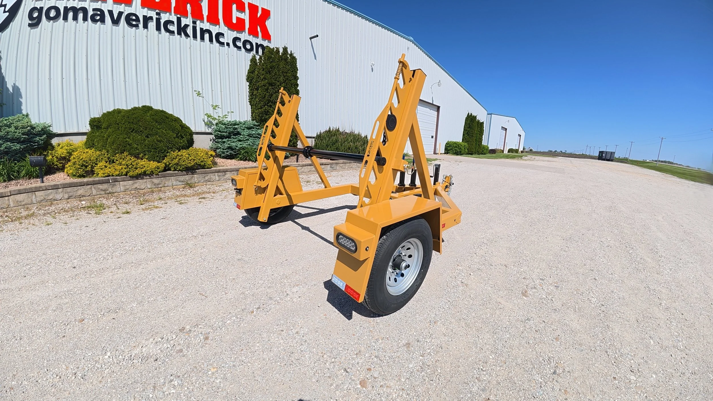Single Reel Self Loading 7,000 lb. Axle Rated Trailer. From small fiber spools to large-diameter HDPE, PVC conduit, innerduct, and heavy electrical cable. Left rear corner view.