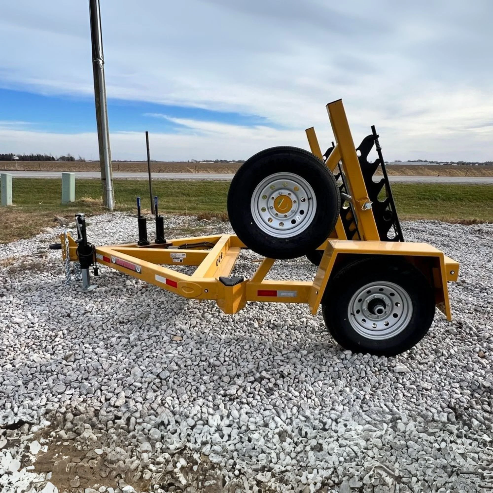 Side view of a 7K CG Single Reel Self Loading Trailer sold by Maverick, Inc. located in Story City, Iowa