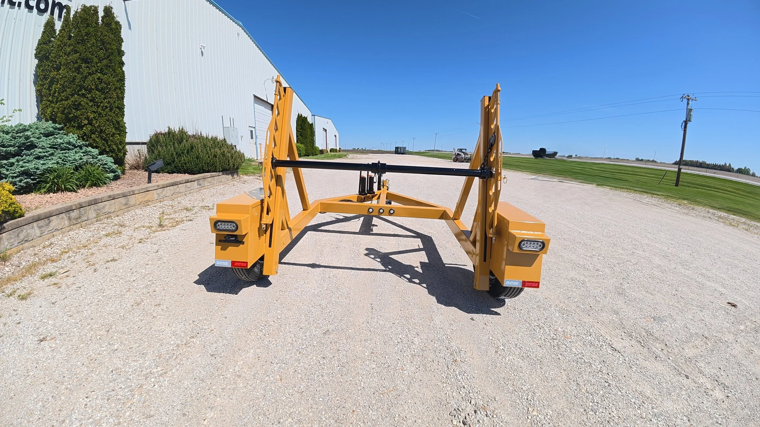 Single Reel Self Loading 7,000 lb. Axle Rated Trailer. From small fiber spools to large-diameter HDPE, PVC conduit, innerduct, and heavy electrical cable. Rear view.