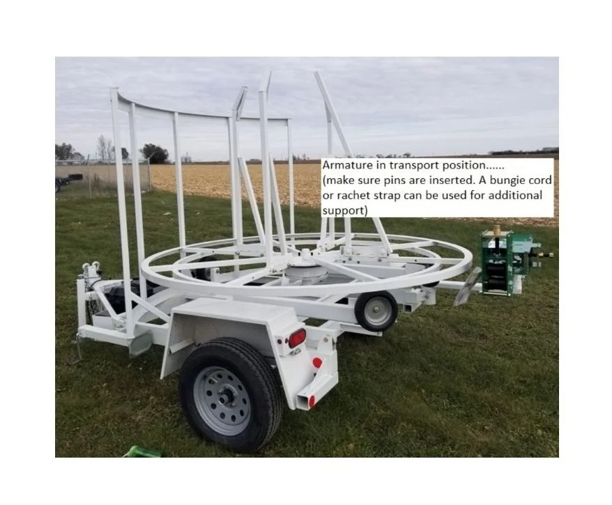 Trailer Mounted McElroy 2" Coil Pipe Line Tamer Armature in Transport Position. Left Side View.