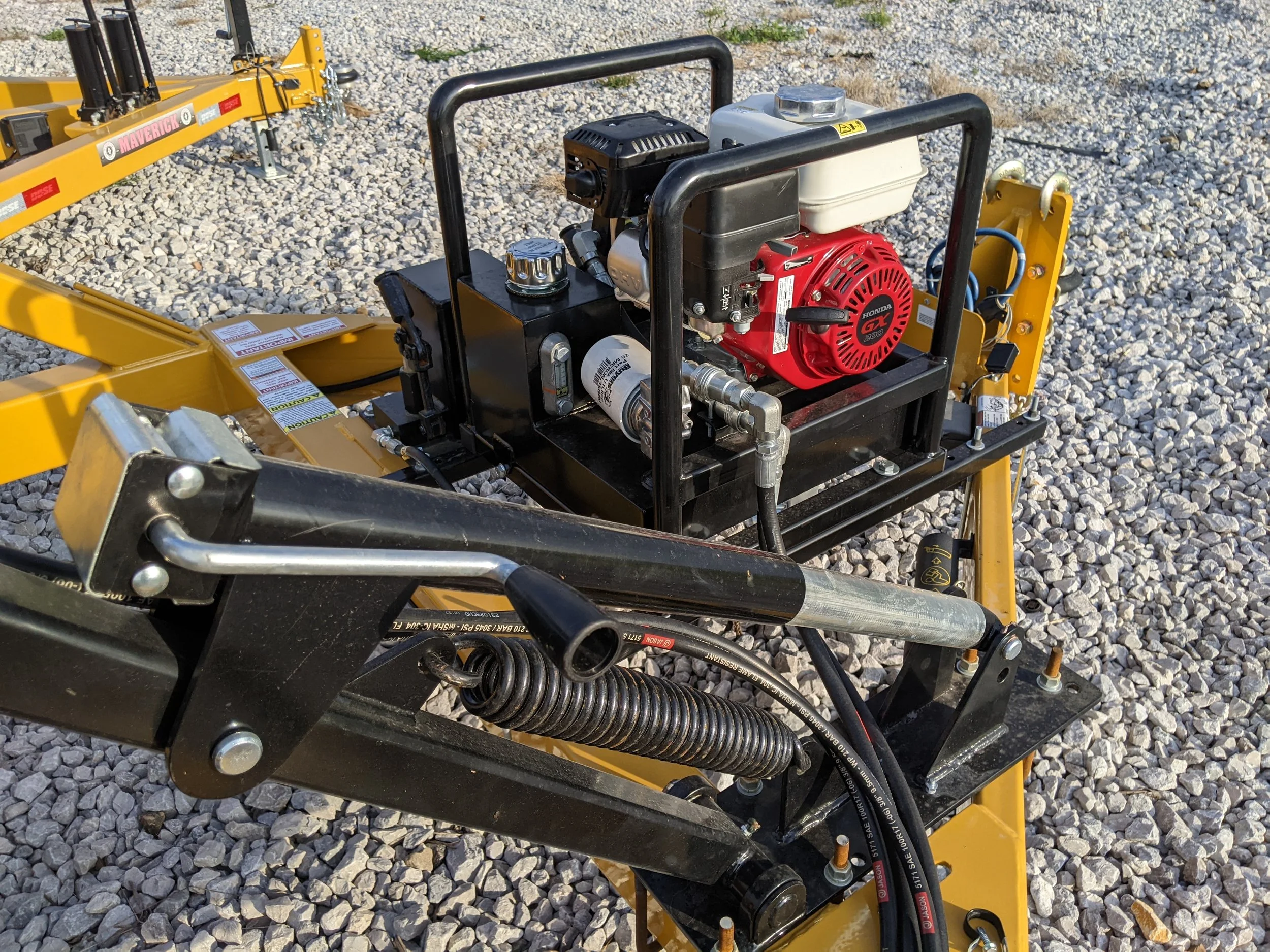 Picture of the arm adjustment jack for the adaptable power rewind for single reel trailers.