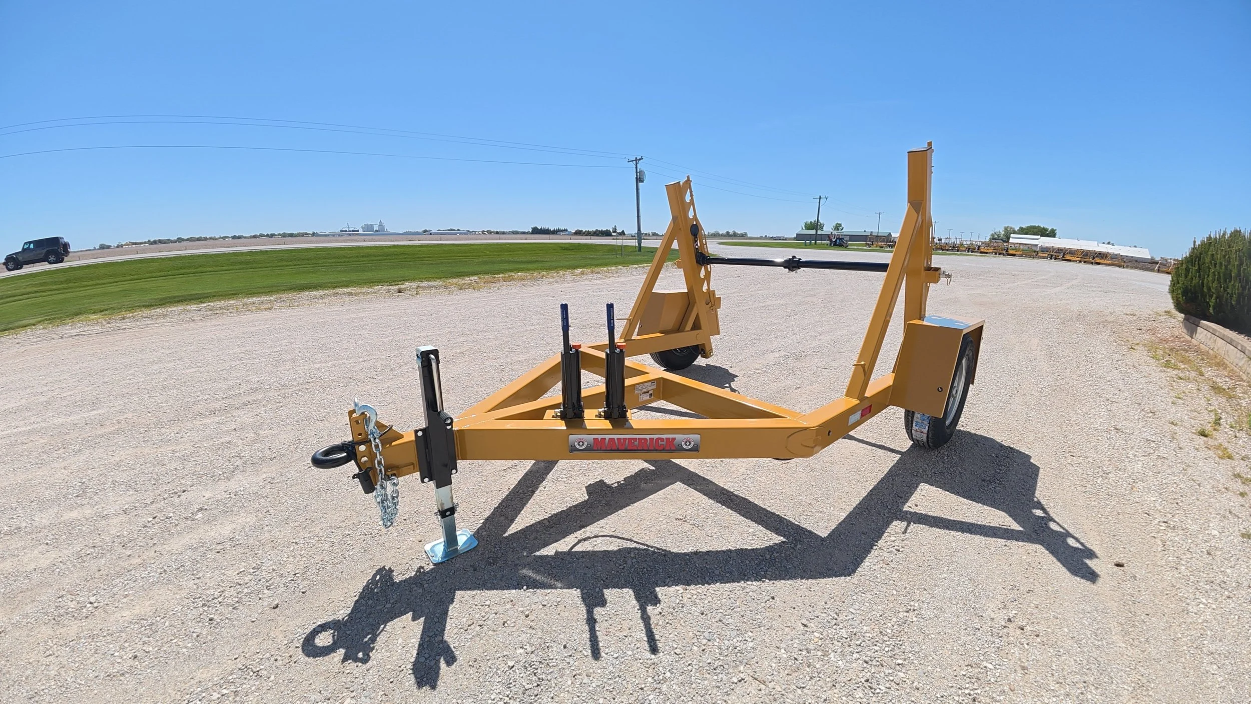 Single Reel Self Loading 7,000 lb. Axle Rated Trailer. From small fiber spools to large-diameter HDPE, PVC conduit, innerduct, and heavy electrical cable. Left side, pump side, view.