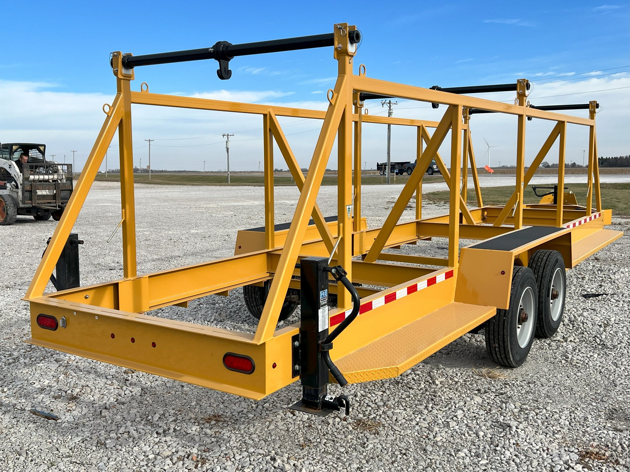Side view of a 2 Reel, Two Reel or Double Reel Cable, Duct or Innerduct Trailer. Used for Transport and installation of utility products.