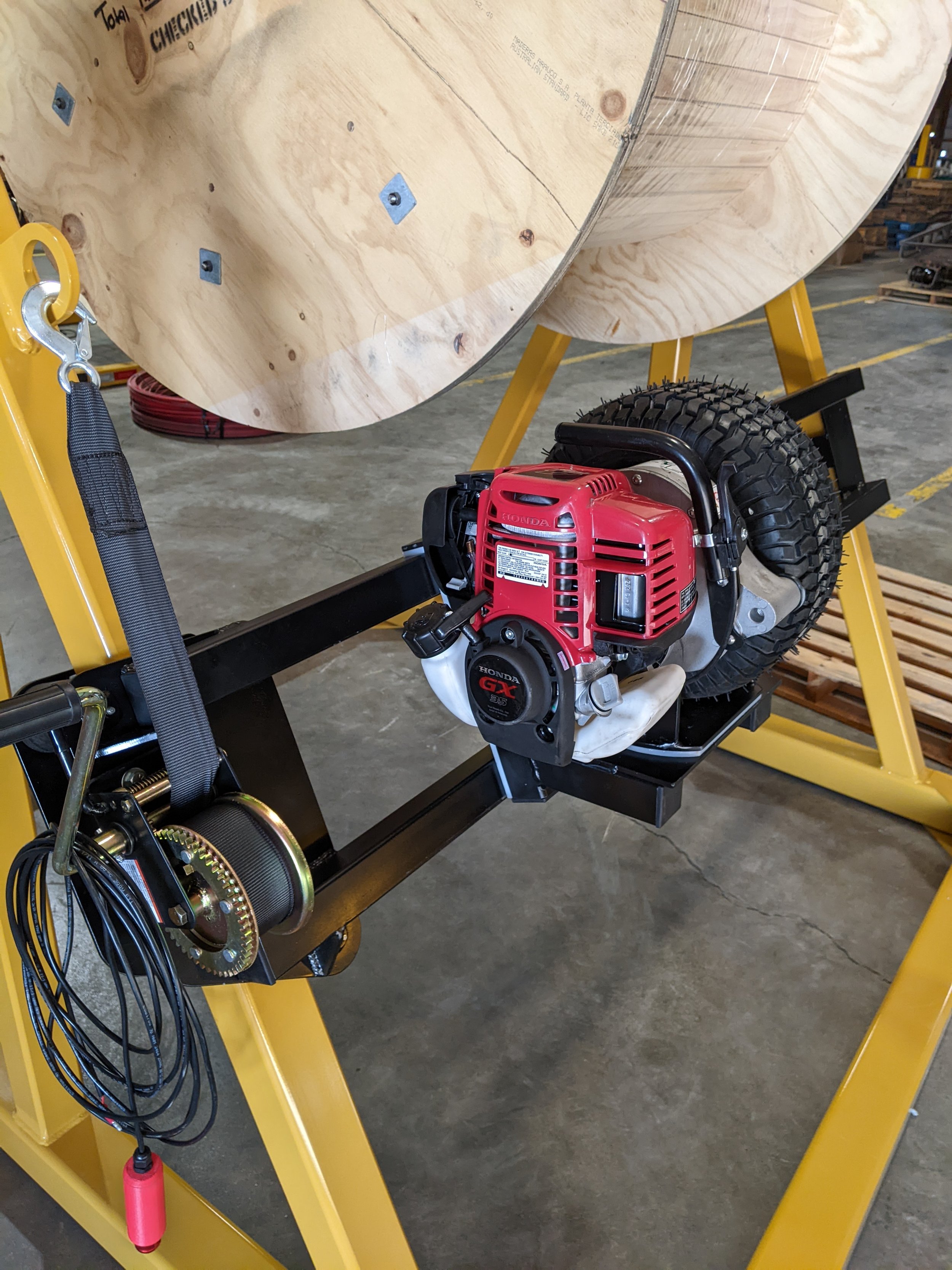 Side view of reel stand gas powered rewind.