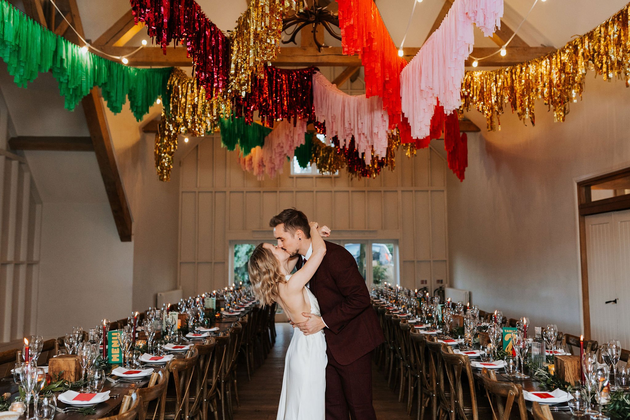 Colourful streamer Festive Wedding at Hyde House in Cotswolds