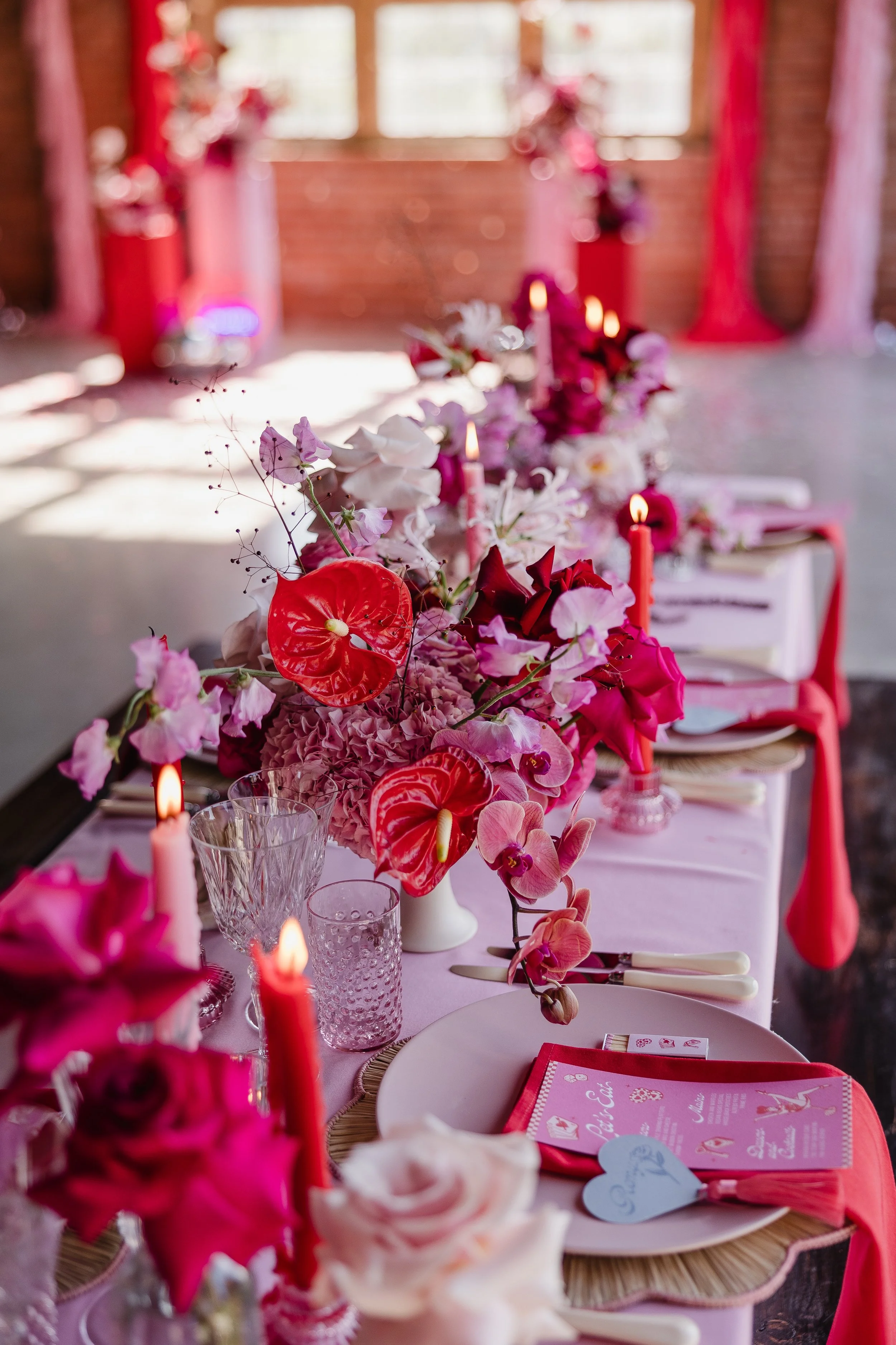 red and pink modern tablescape with vegas inspired shoot